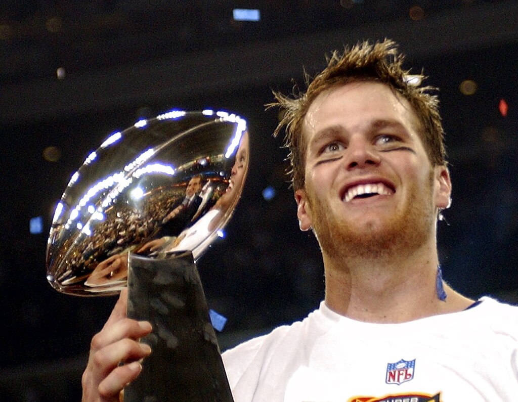 New England Patriots quarterback Tom Brady holds the Vince Lombardi Trophy after the Patriots beat the Carolina Panthers 32-29 in Super Bowl 38 in Houston in 2004.