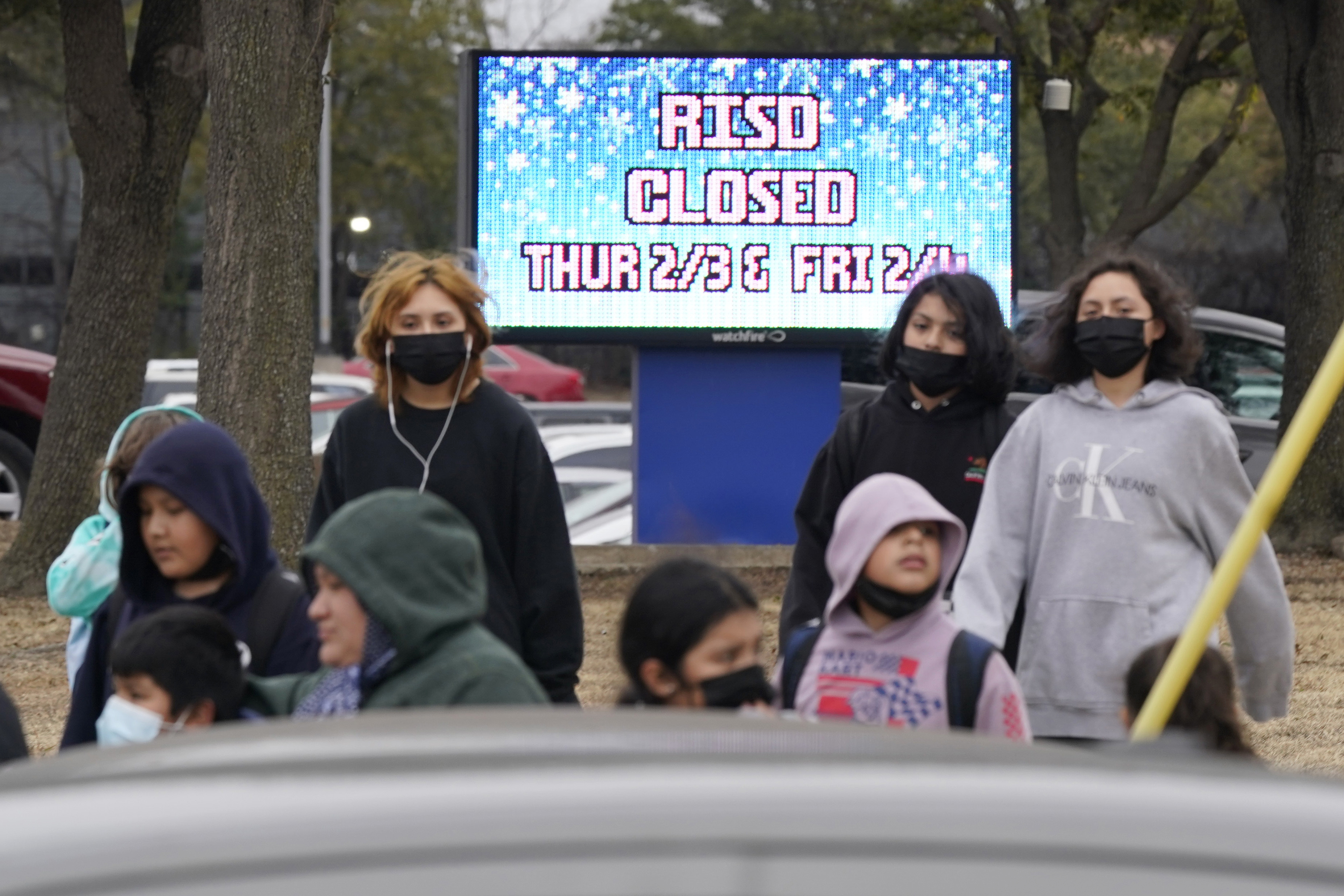 A sign tells that the school has been canceled due to impending winter weather in Dallas