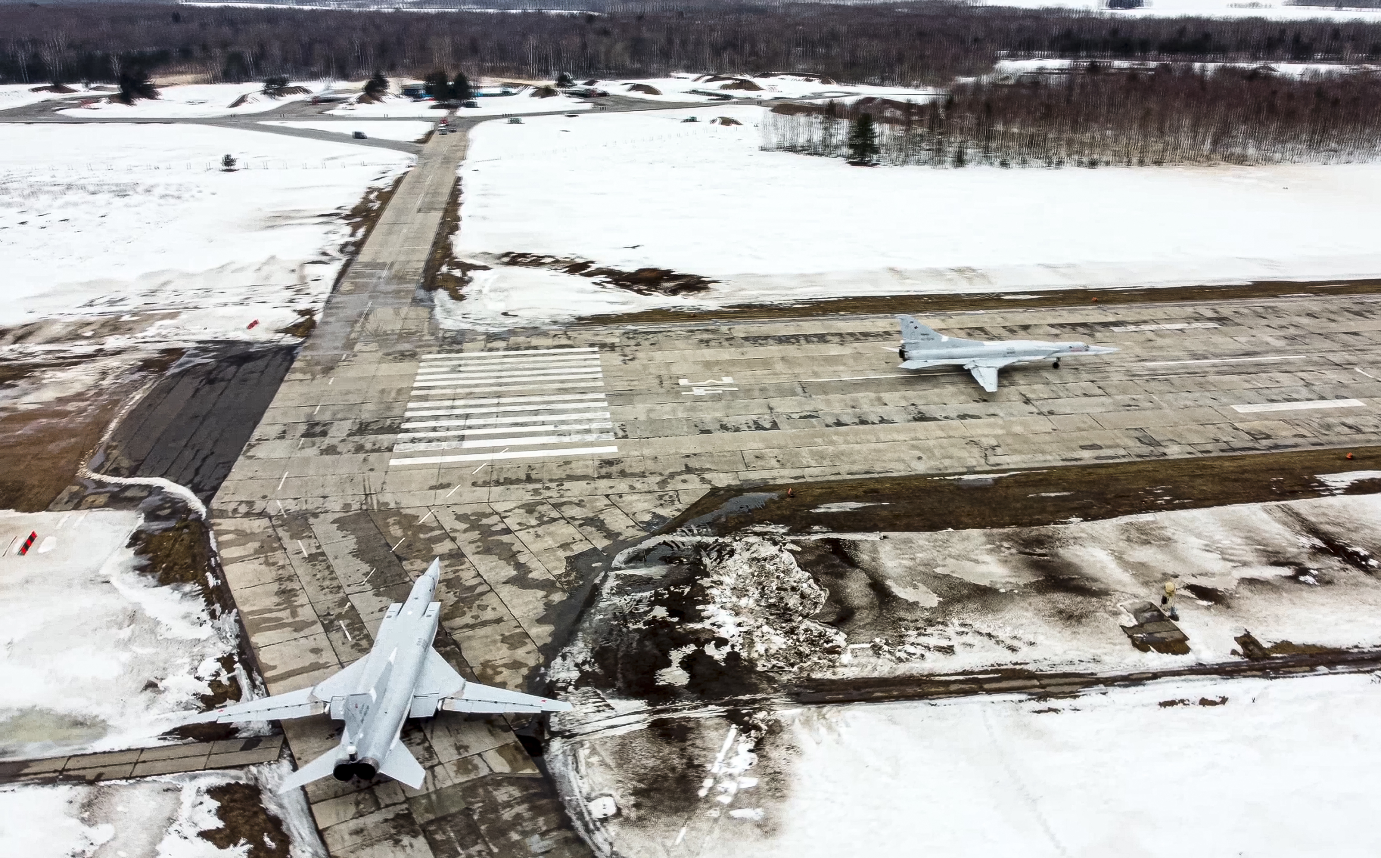 In this photo taken from video and released by the Russian Defense Ministry Press Service on Saturday, February 5, 2022, a pair of Tu-22M3 bombers of the Russian air force taxi before takeoff at an air base in Russia. Two Tu-22M3 long-range bombers of the Russian air force performed a patrol mission over Belarus on Saturday amid the tensions over Ukraine. (Russian Defense Ministry Press Service via AP)