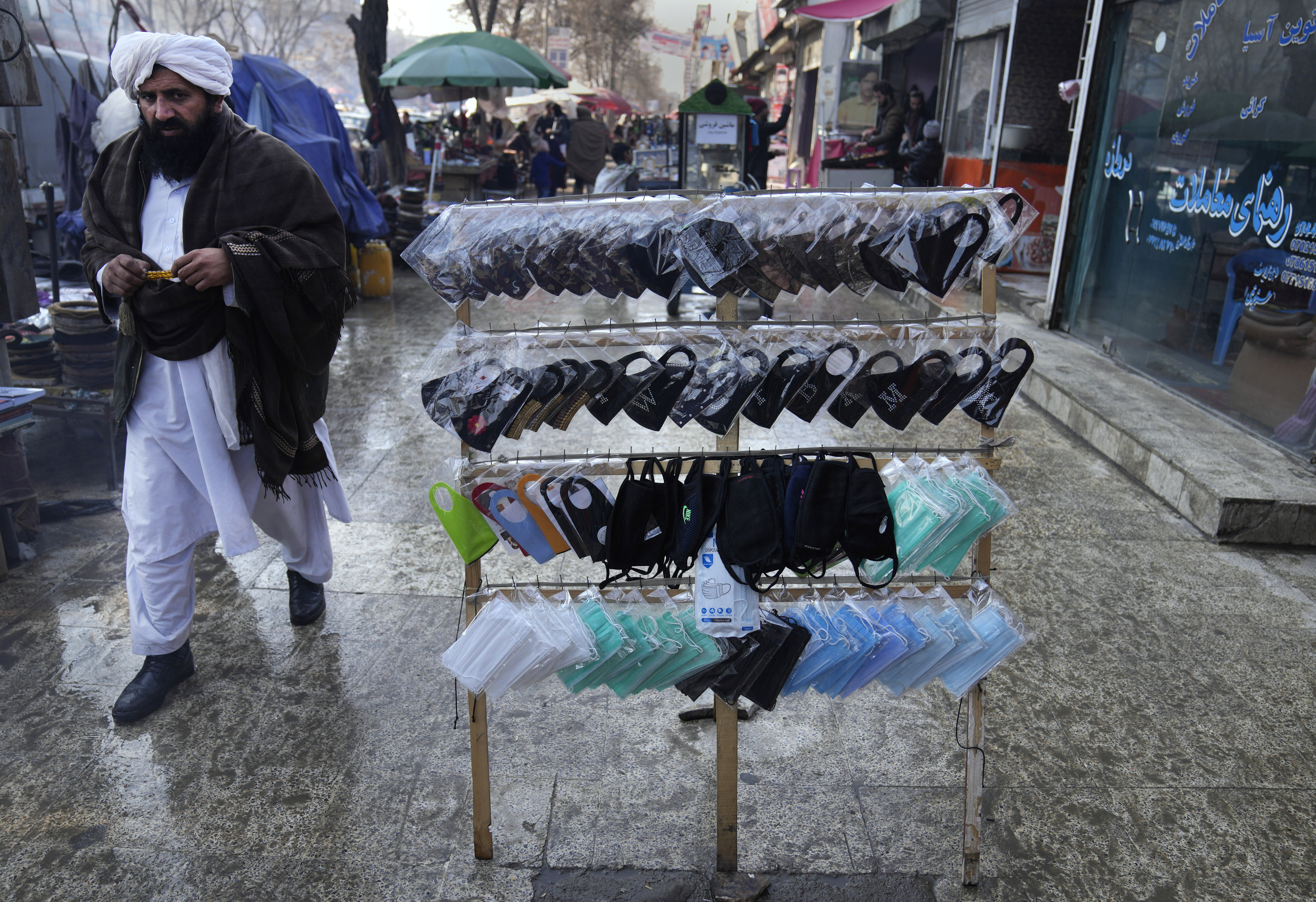 Masks to help prevent the spread of the coronavirus are on sale sale at a market, in Kabul
