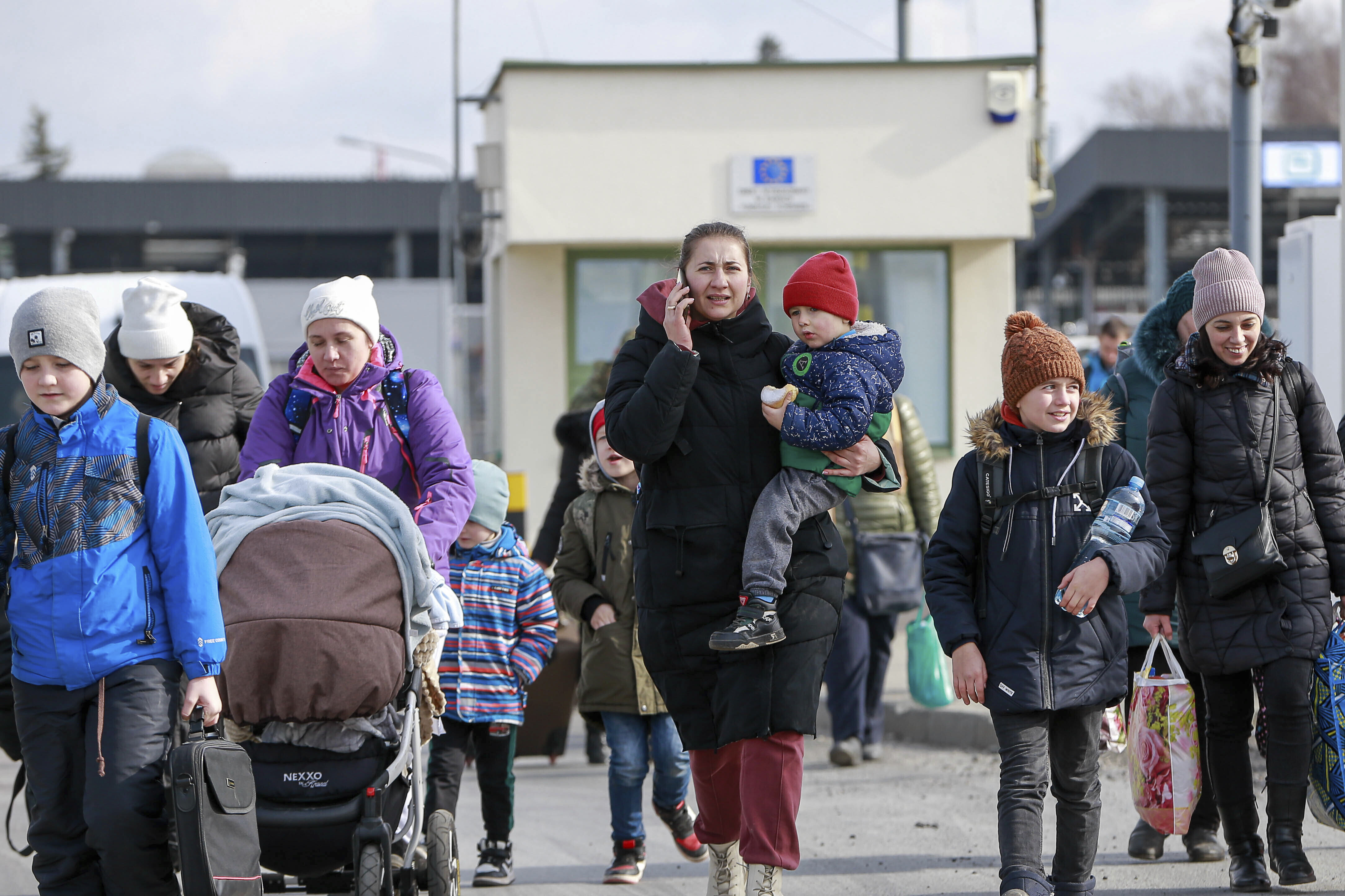 Refugees from Ukraine are seen arriving at the Medyka border crossing in Poland