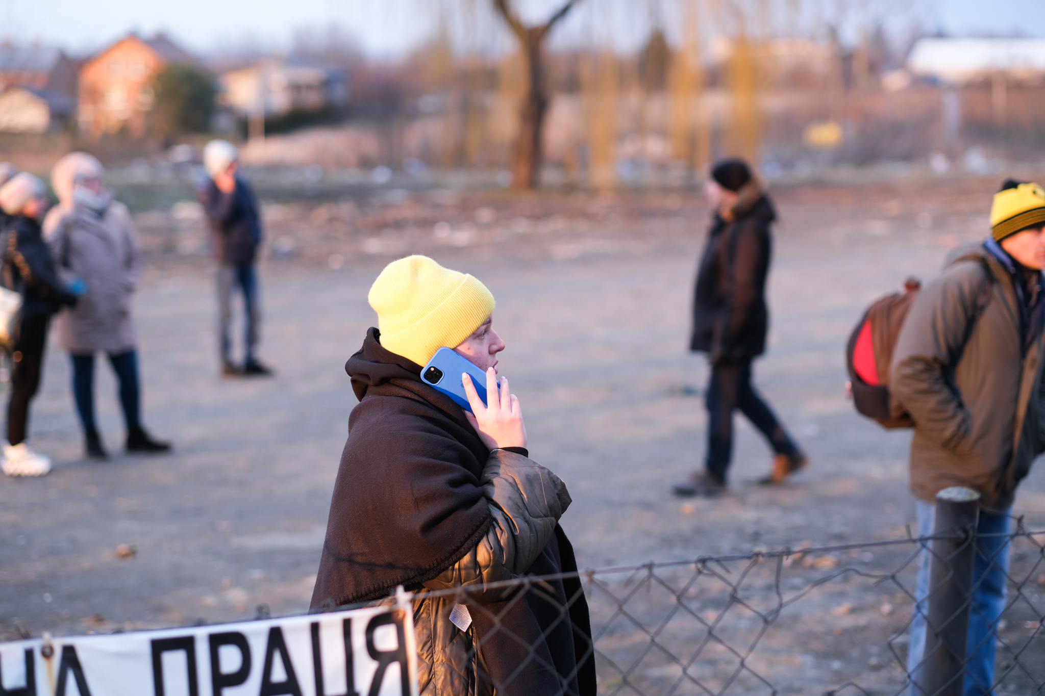 Olga speaks on the phone and waits anxiously for her grandmother.