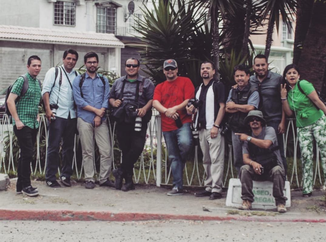 Margarito Martinez and his journalist friends pose for a photo 