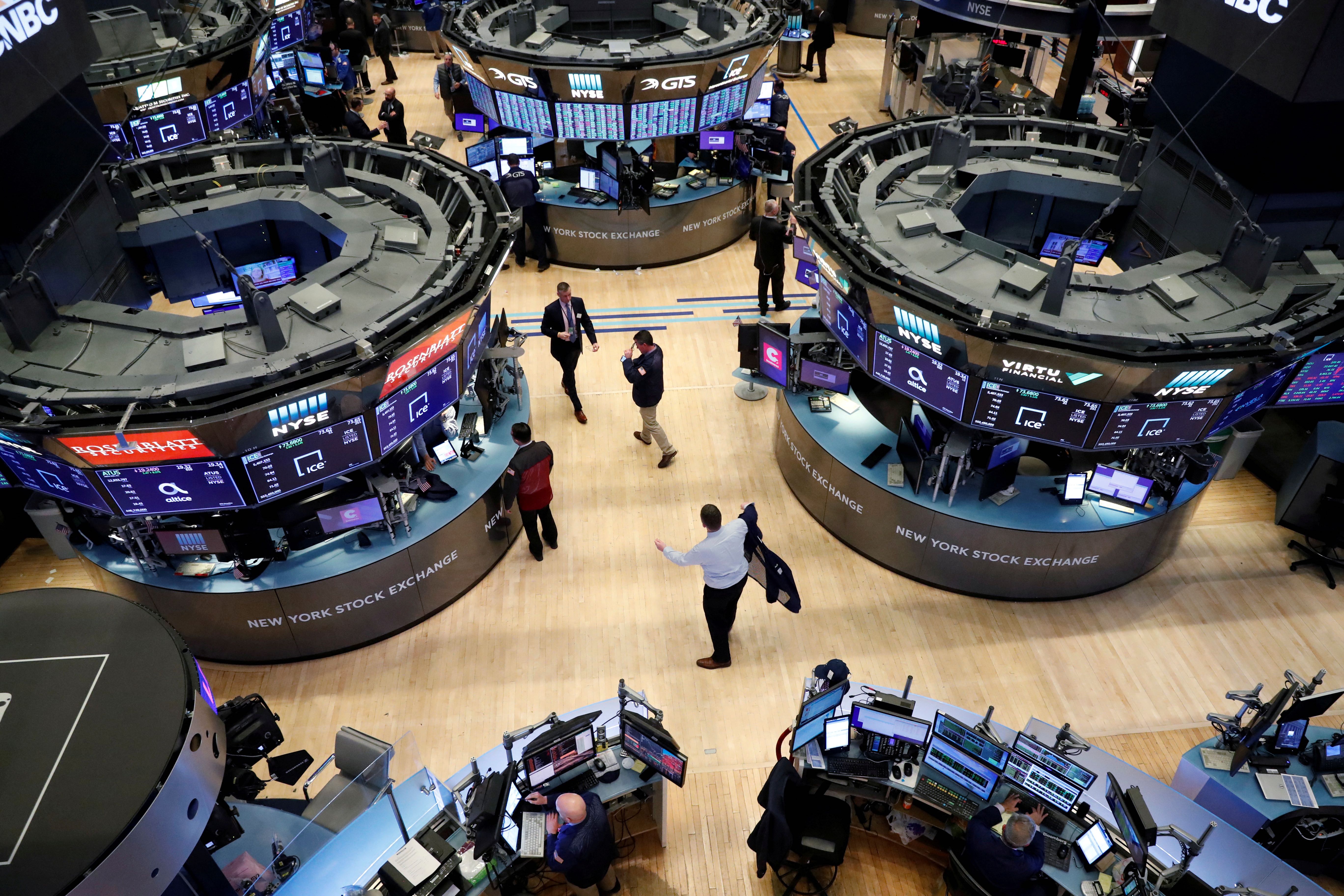 Traders work on the floor of the New York Stock Exchange