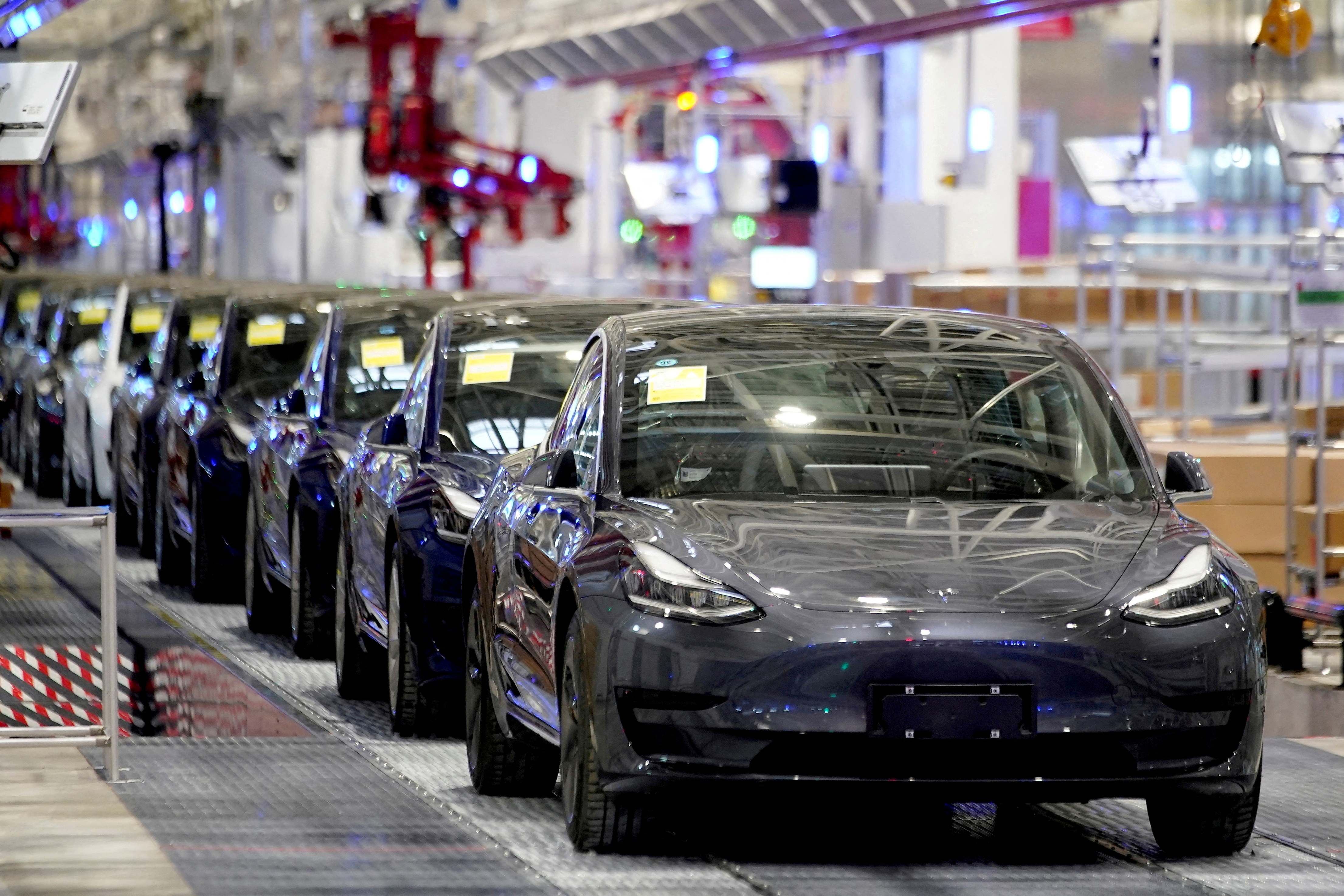 Tesla's China-made Model 3 vehicles are seen during a delivery event at its factory in Shanghai, China