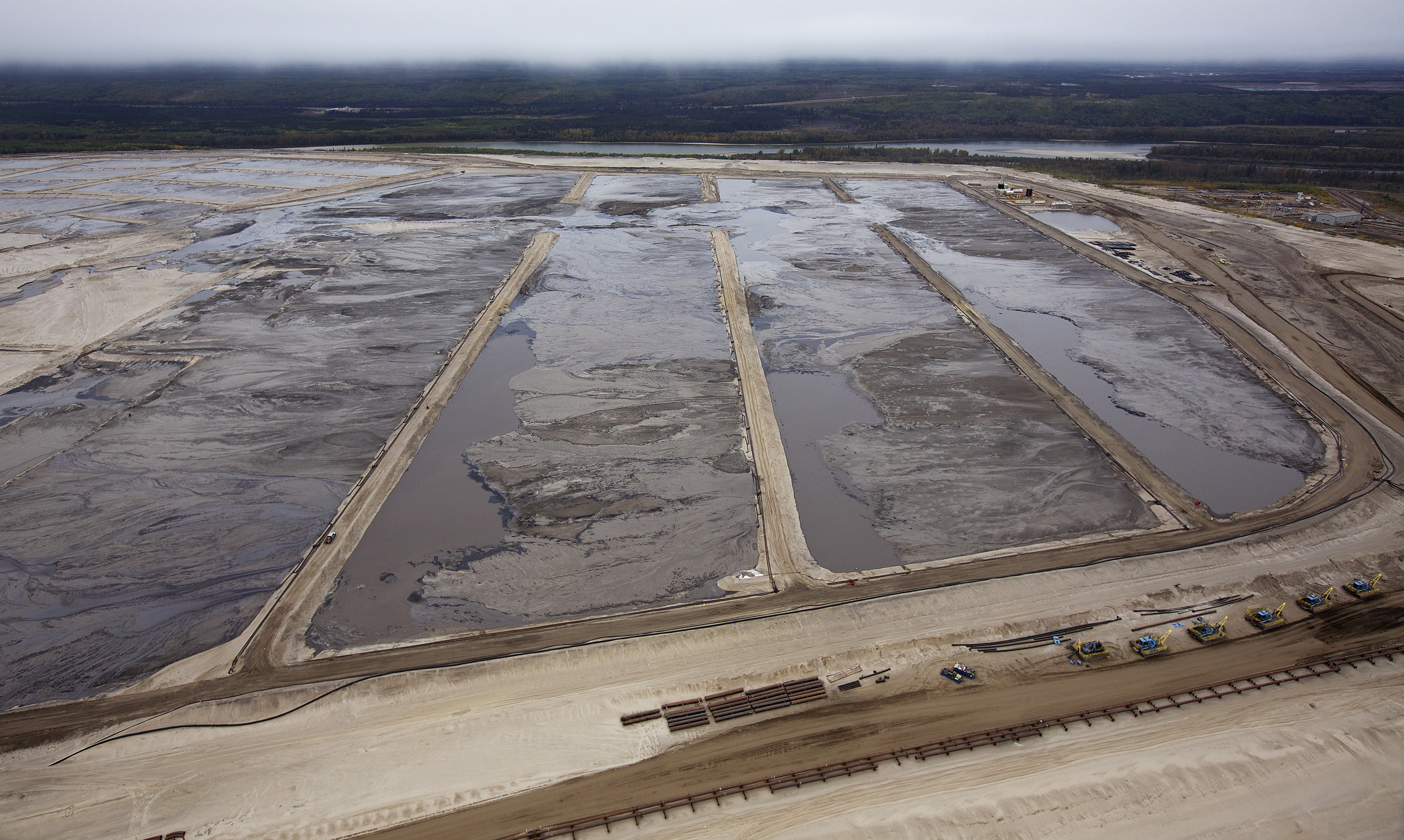 Tailing ponds are seen at the Suncor tar sands mining operations in 2014