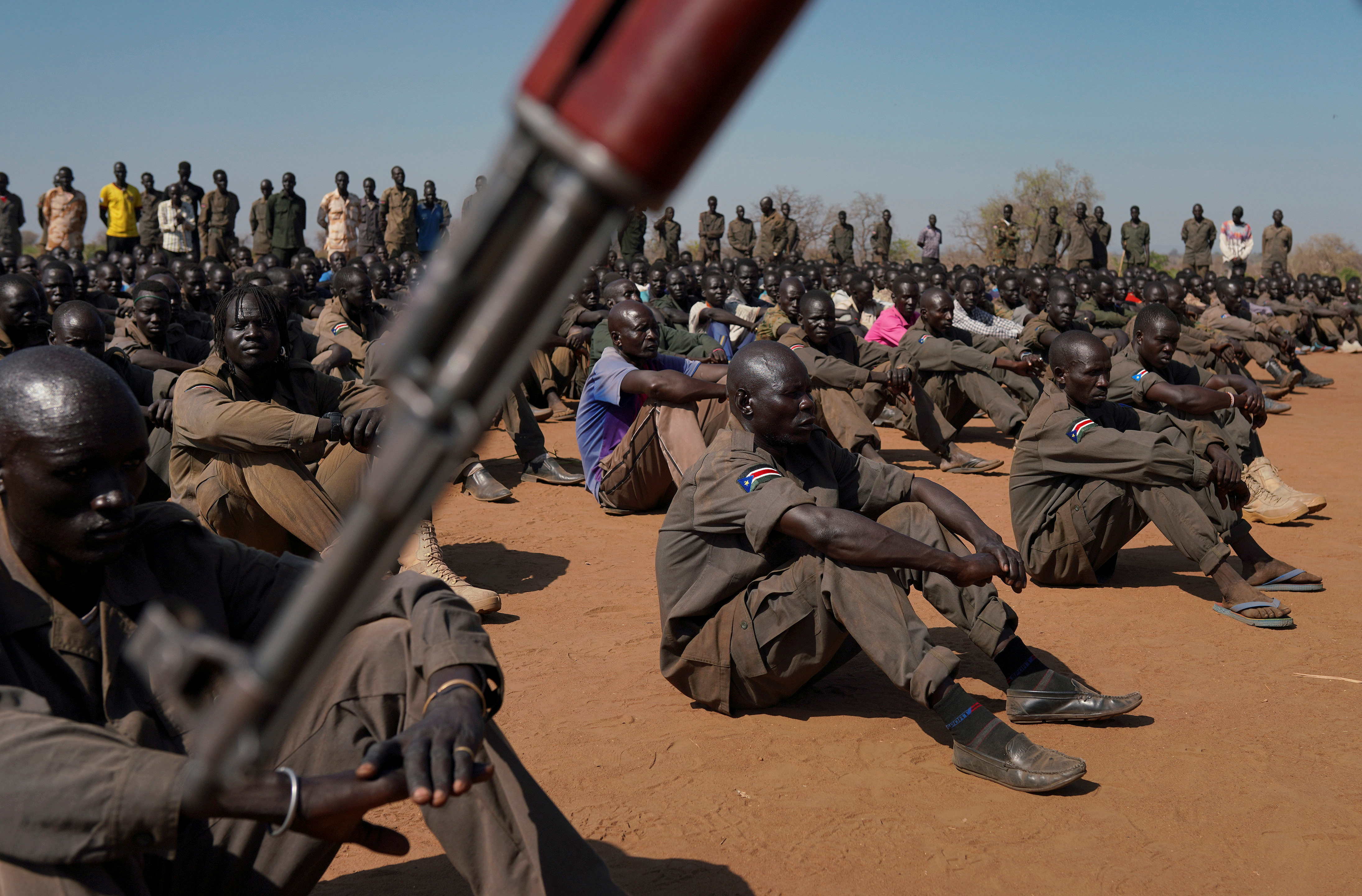 South Sudan People's Defence Forces (SSPDF), South Sudan Opposition Alliance (SSOA), and The Sudan People's Liberation Movement in Opposition (SPLM-IO) soldiers gather at the training site for the joint force to protect VIPs