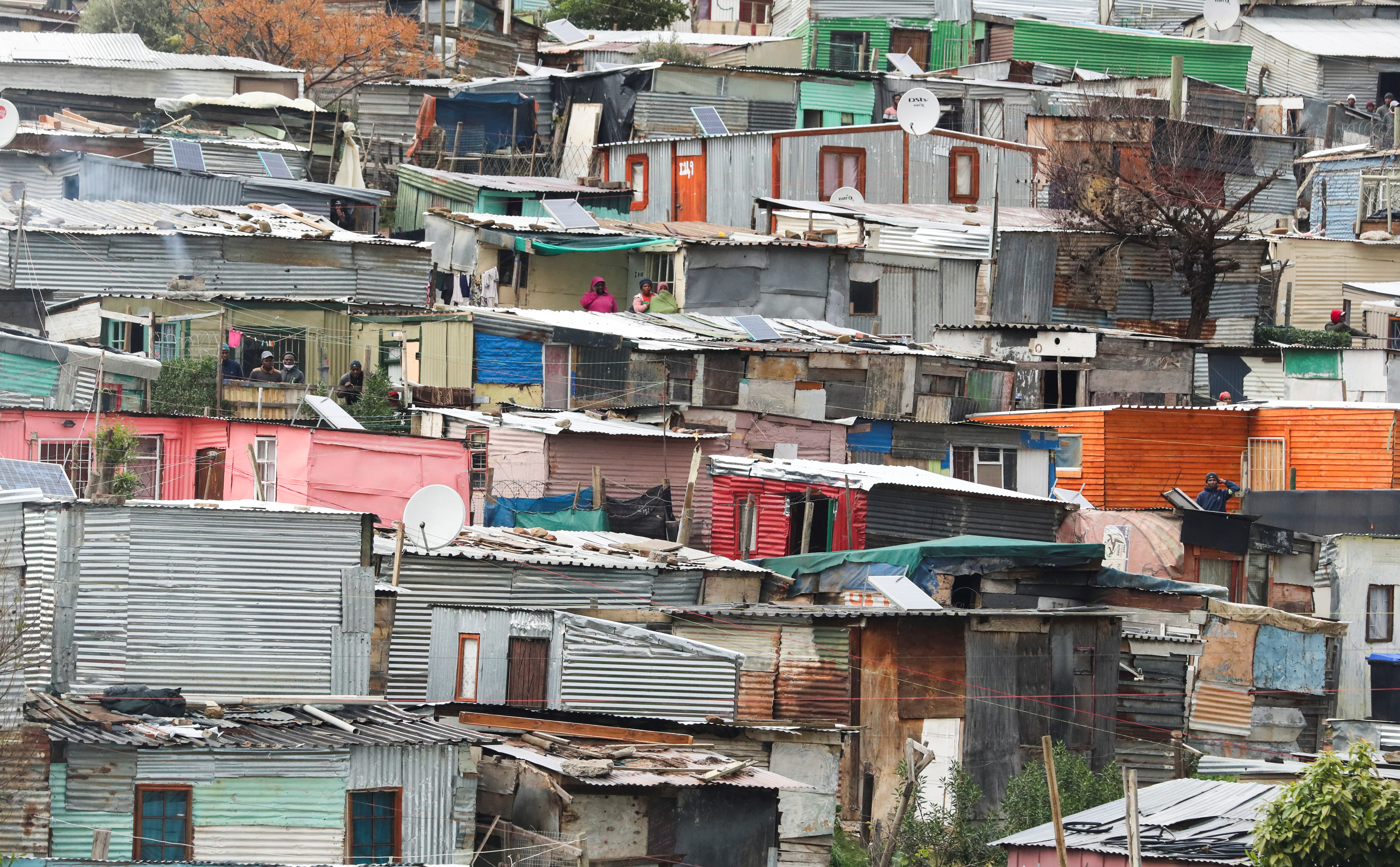 Shacks are seen lined closely together in Kayamandi township near Stellenbosch, South Africa