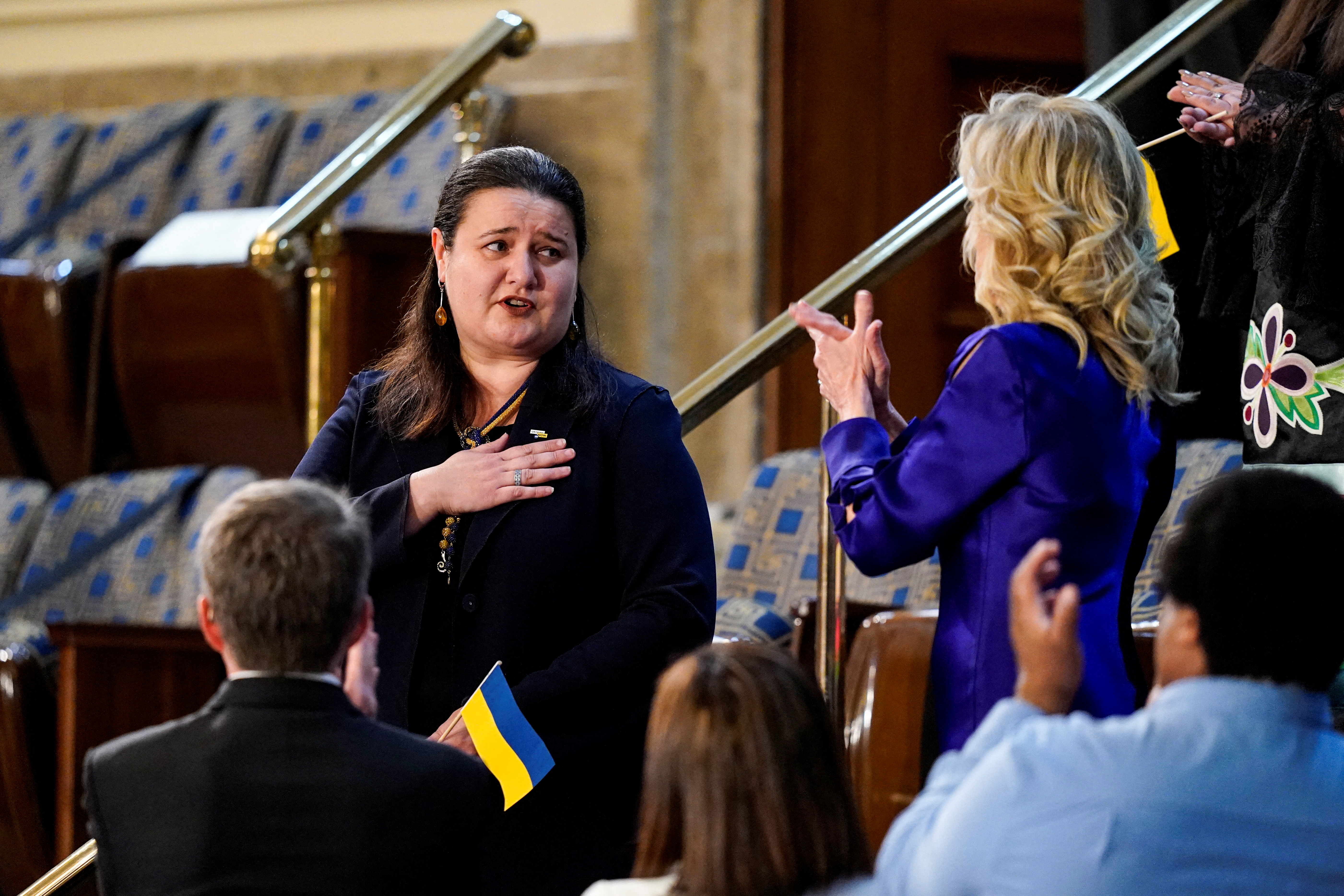 Ukrainian Ambassador to the U.S. Oksana Markarova reacts as first lady Jill Biden welcomes her during U.S. President Joe Biden's first State of the Union address