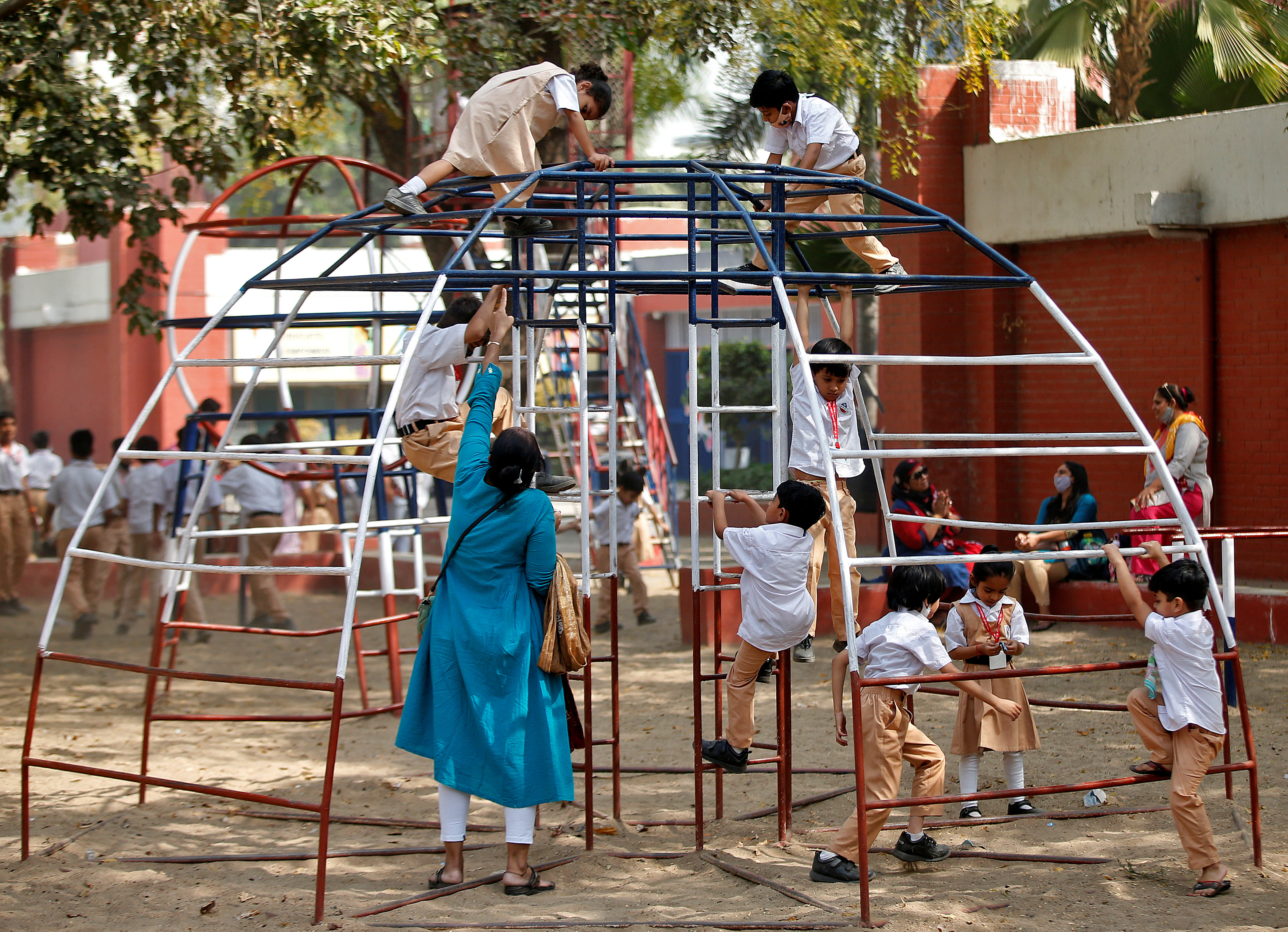 Students play during recess at a school after a majority of schools were reopened following their closure due to the coronavirus disease (COVID-19) pandemic, in Ahmedabad,