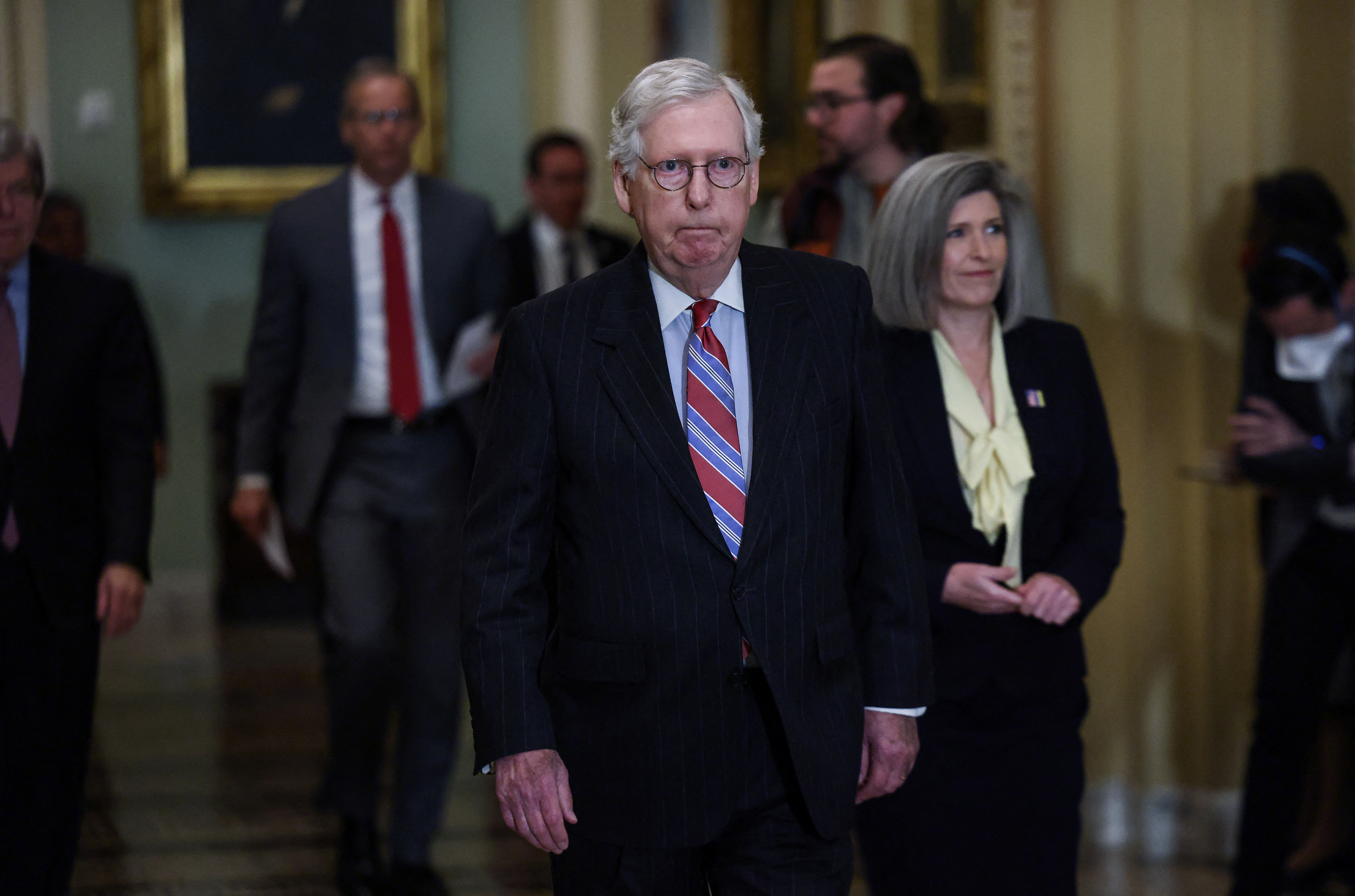 US Senate Minority Leader Mitch McConnell arrives to face reporters questions following the Senate Republicans weekly policy lunch at the US Capitol on March 8