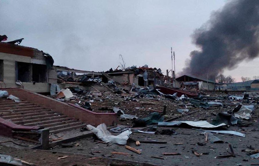 Smoke rises amid damaged buildings following an attack on the Yavoriv military base.