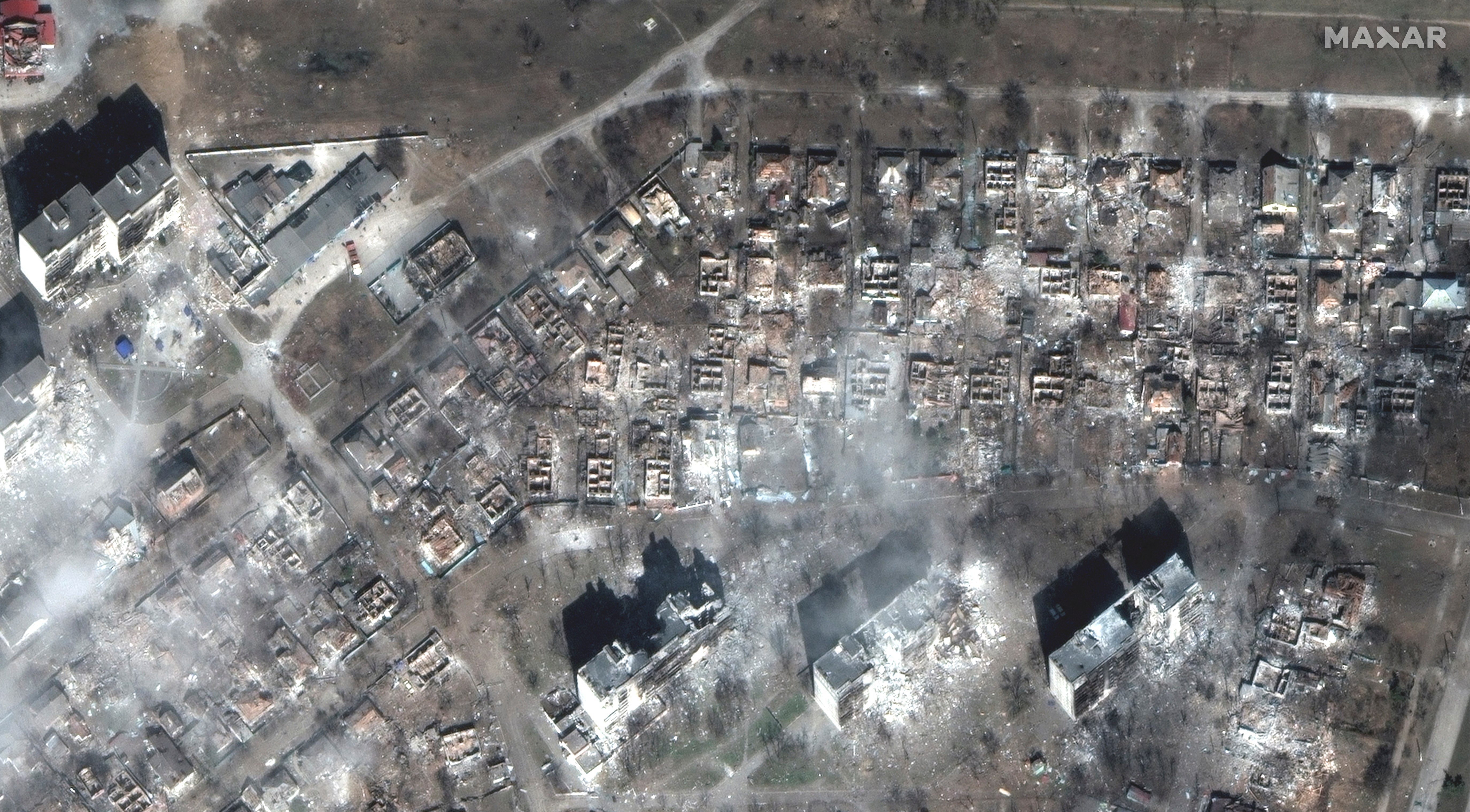 A satellite image shows apartment buildings and homes destroyed on east Mariupol, Ukraine March 29, 2022.