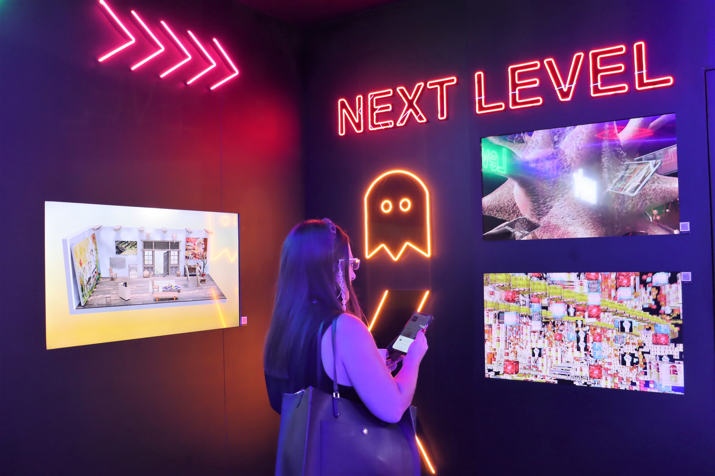 A selection of NFT art at the Bybit booth at Art Dubai Digital