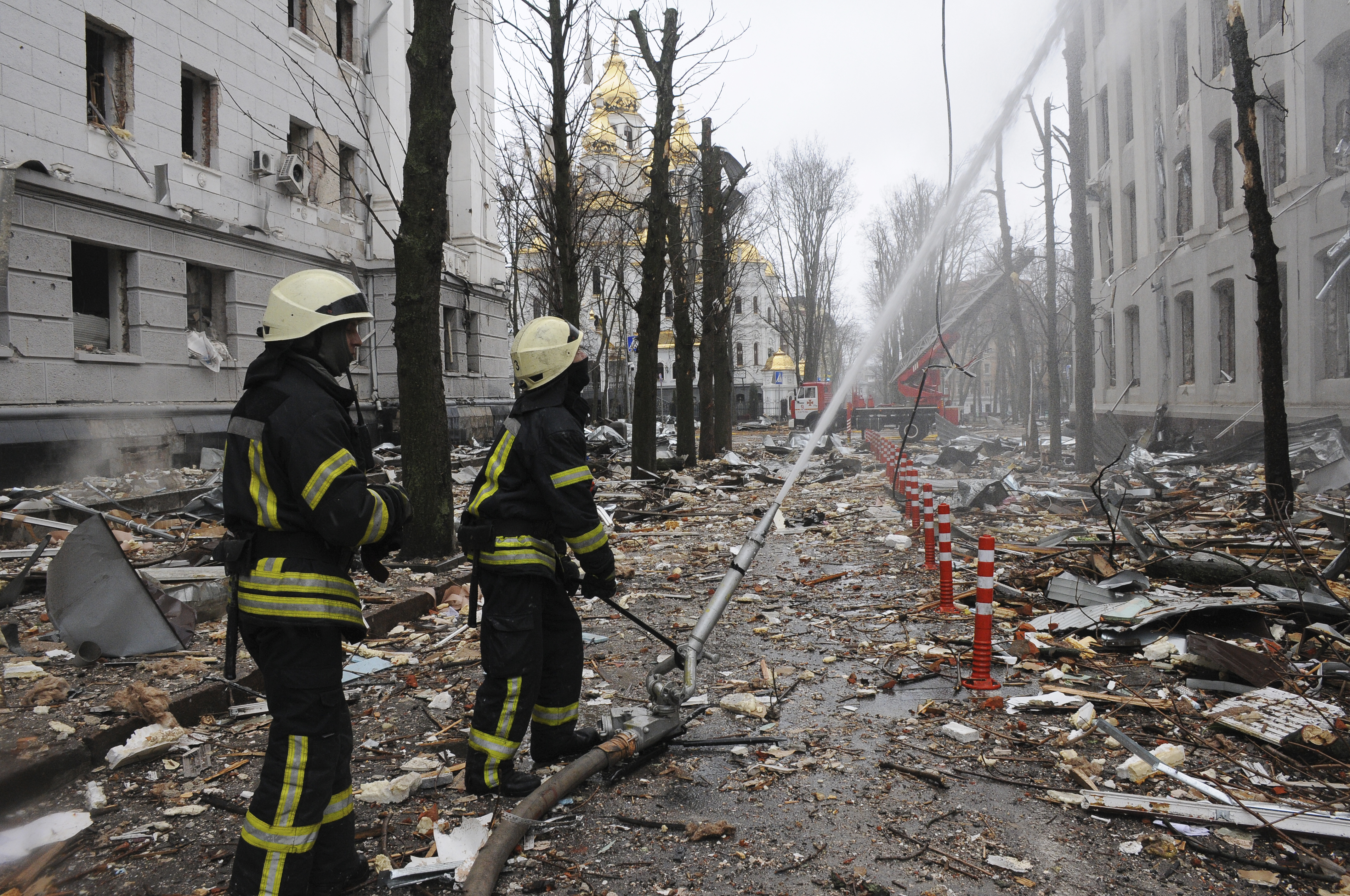 Firefighters extinguish a building of Ukrainian Security Service (SBU) after a rocket attack in Kharkiv, Ukraine's second-largest city, Ukraine