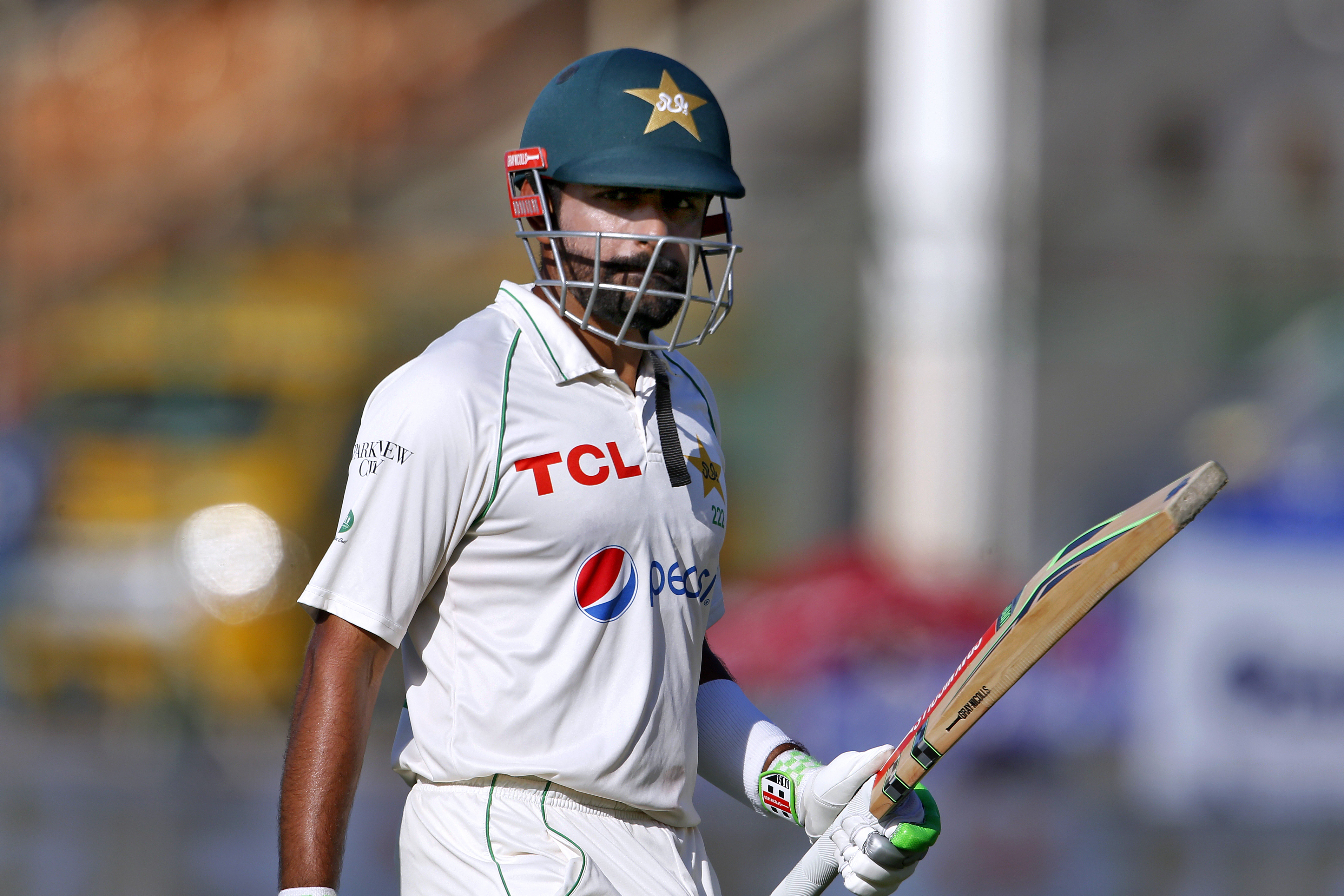 Pakistan's Babar Azam walks back to pavilion after his dismissal on 196 runs