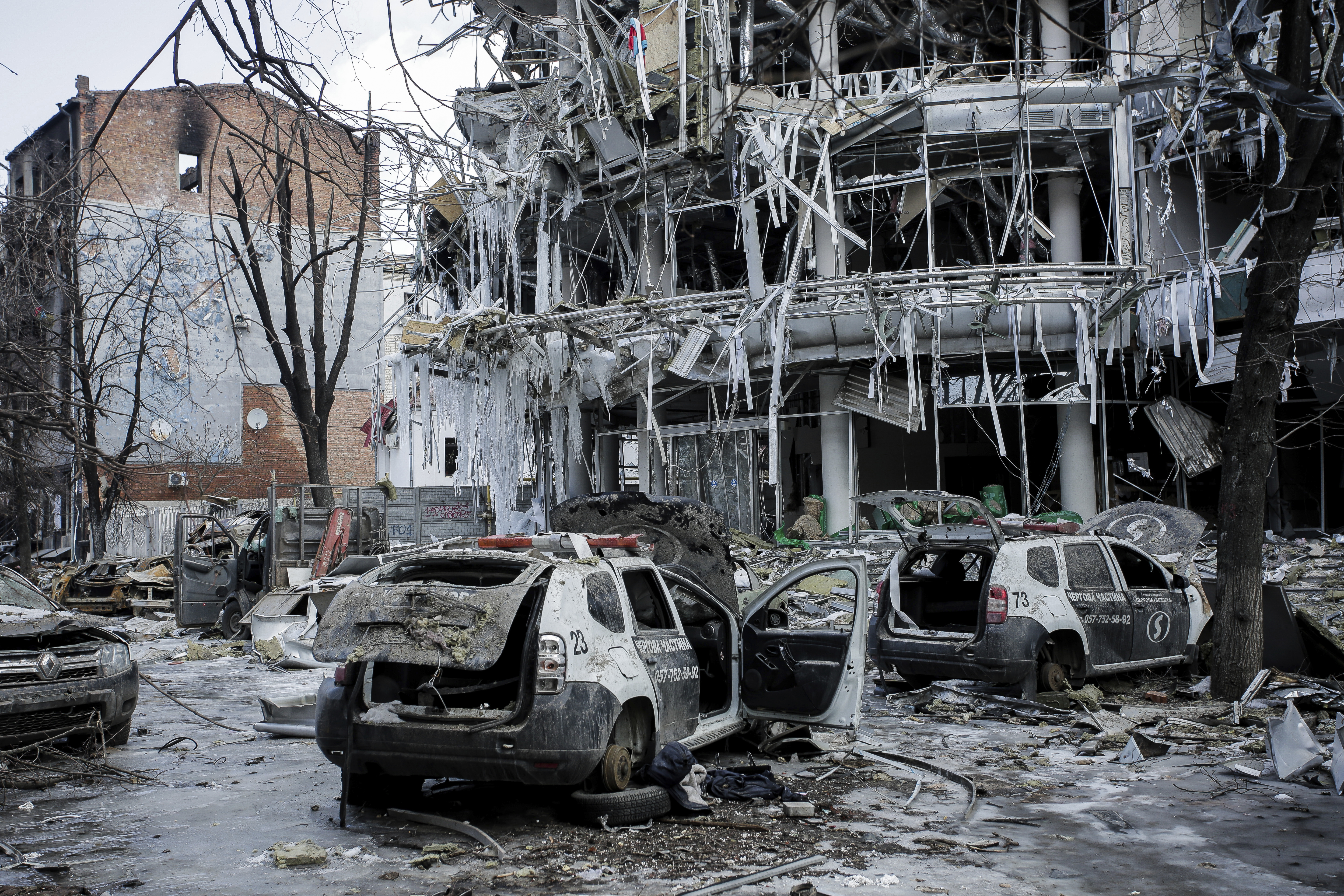 Damaged vehicles and buildings in Kharkiv city center in Ukraine