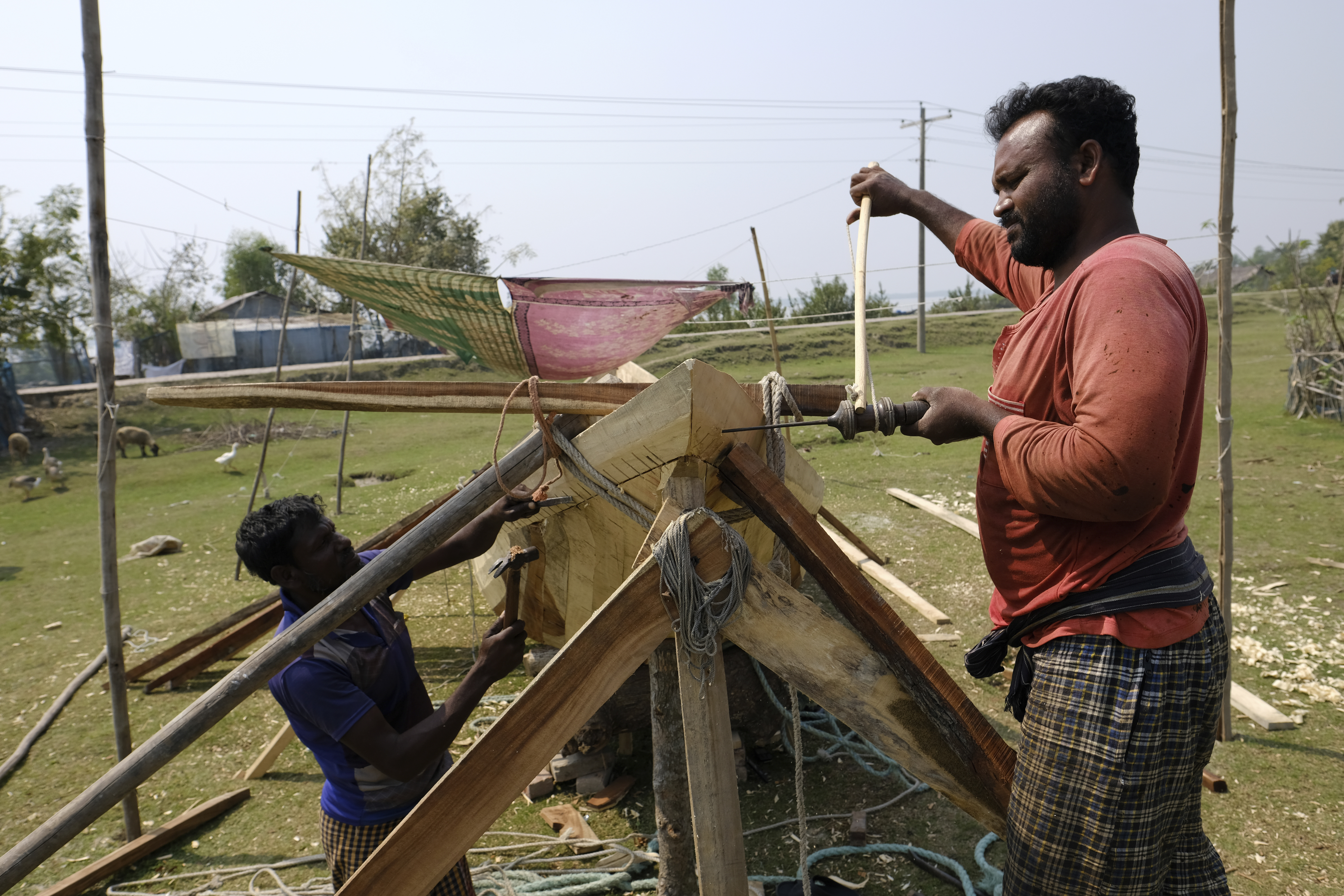 Craftsmen build a fishing boat at Chila Bazar, in Mongla, Bangladesh