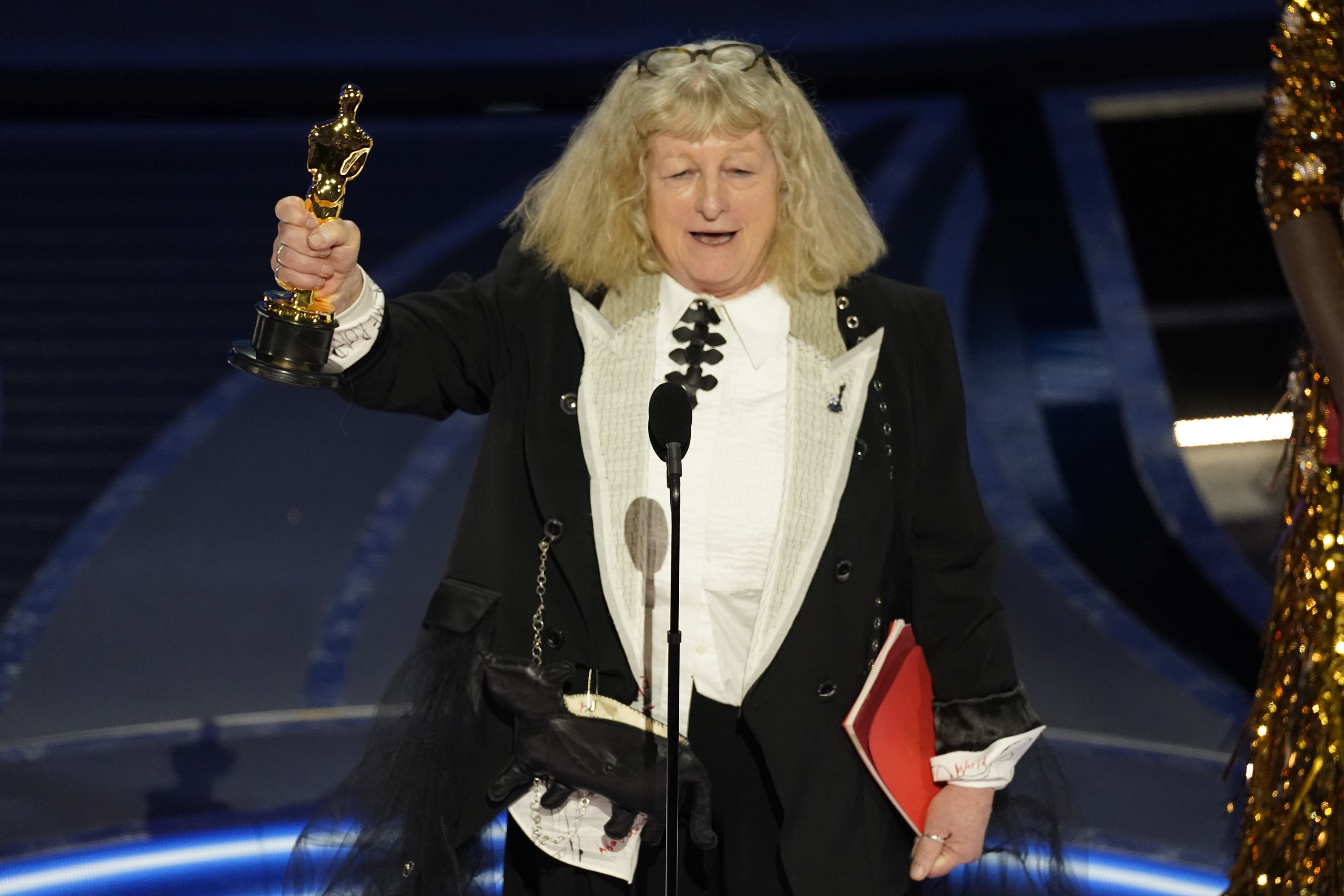 Jenny Beavan accepts the award for best costume design for "Cruella" at the Oscars on Sunday, March 27, 2022, at the Dolby Theatre in Los Angeles. (AP Photo/Chris Pizzello)