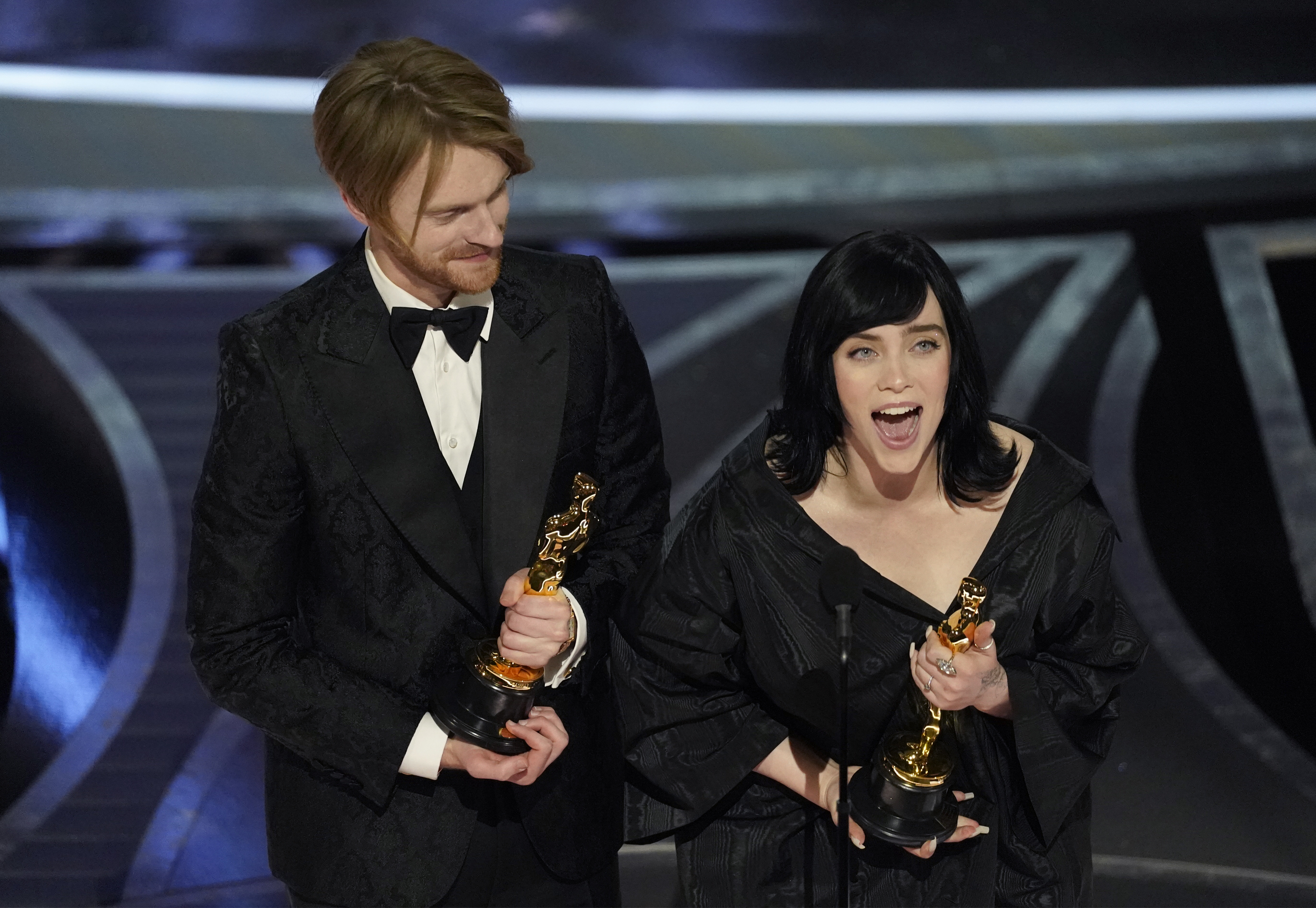 Billie Eilish, right, and Finneas O'Connell accept the award for best original song for "No Time To Die" at the Oscars on Sunday, March 27, 2022, at the Dolby Theatre in Los Angeles