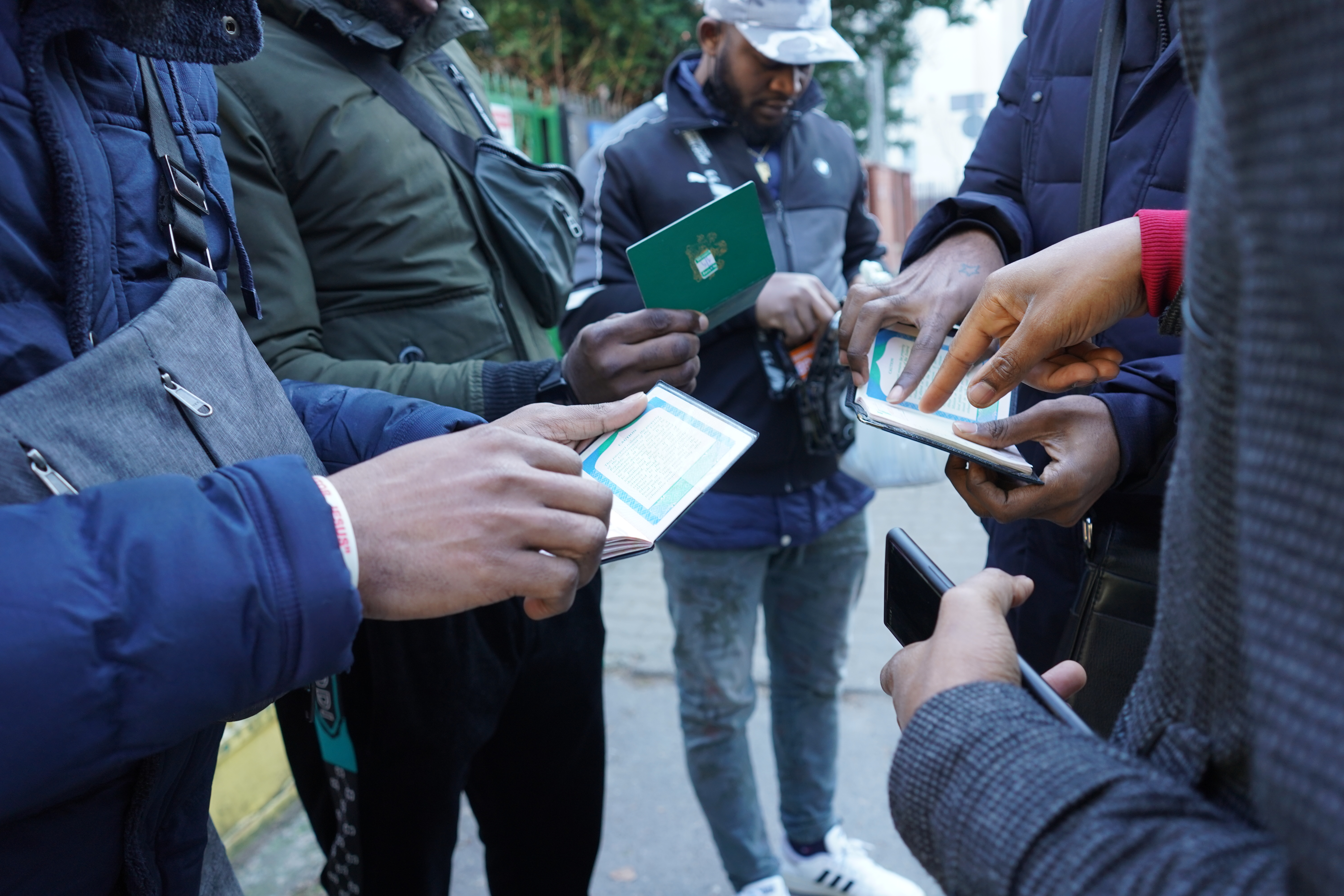 Nigerian refugees from Ukraine seek advice about their legal status outside of a refugee center in Warsaw, Poland"