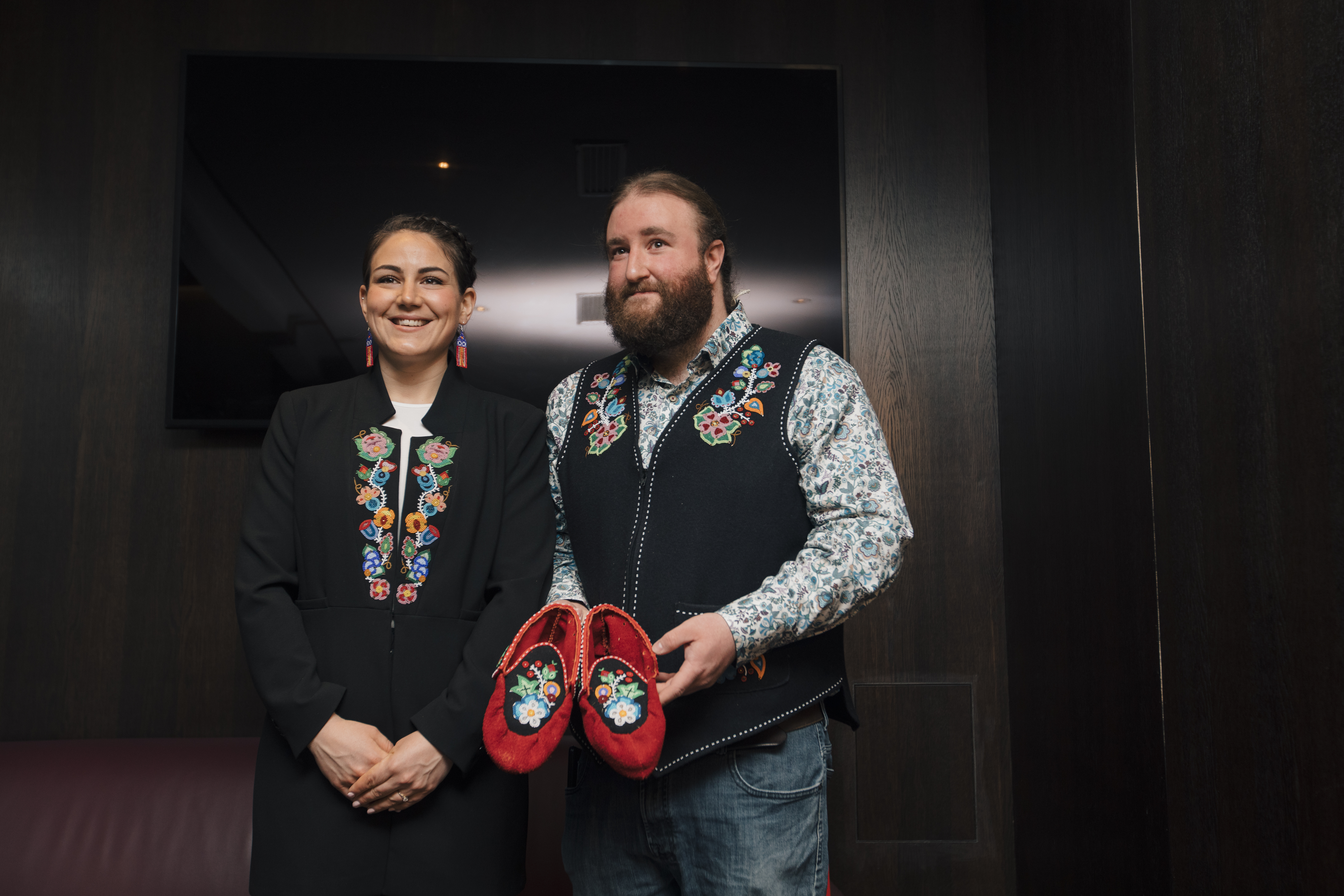 Case holding beaded moccasins