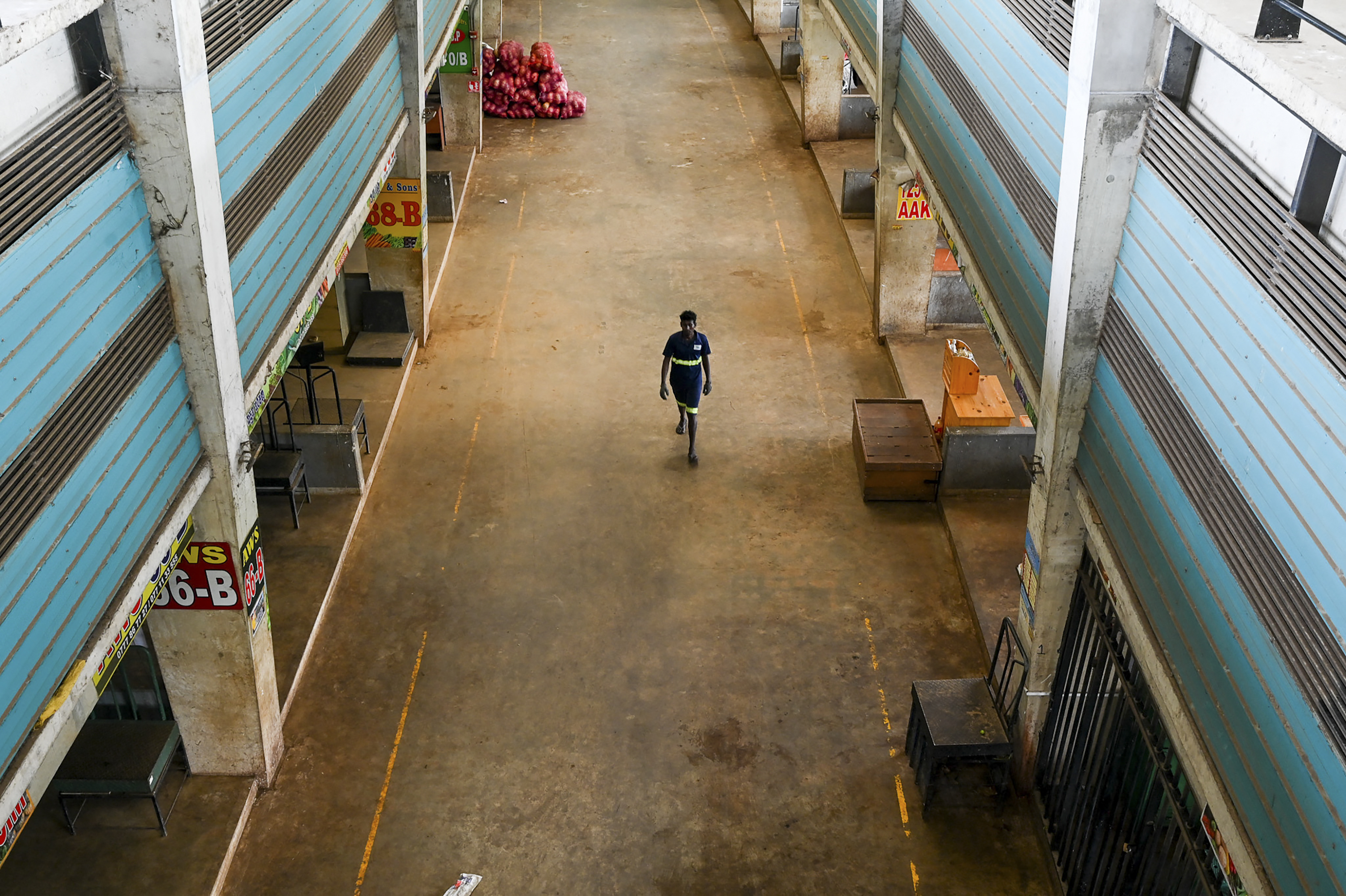 A worker walks at the deserted Manin marke