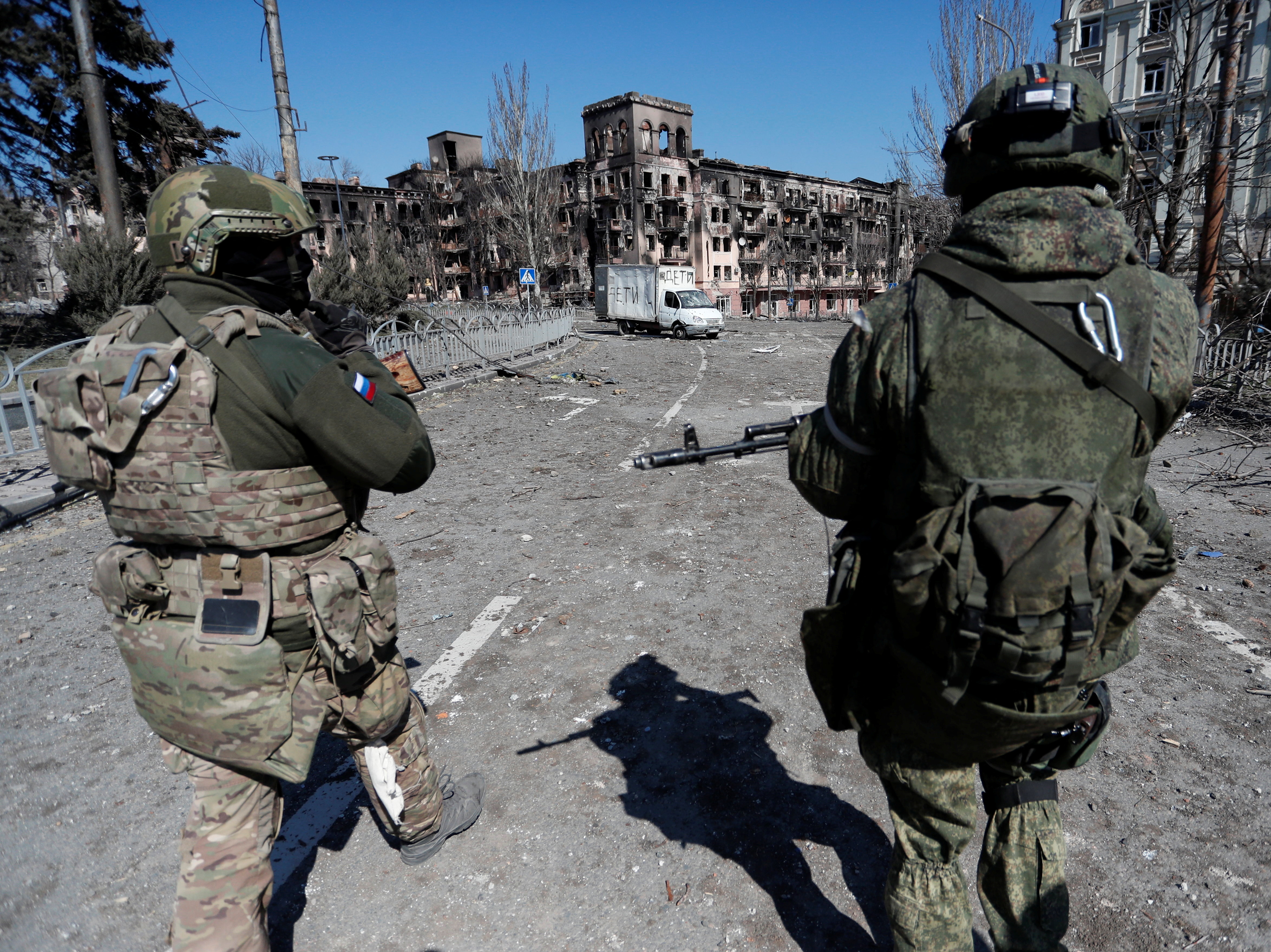 Service members of pro-Russian troops are seen in Mariupol