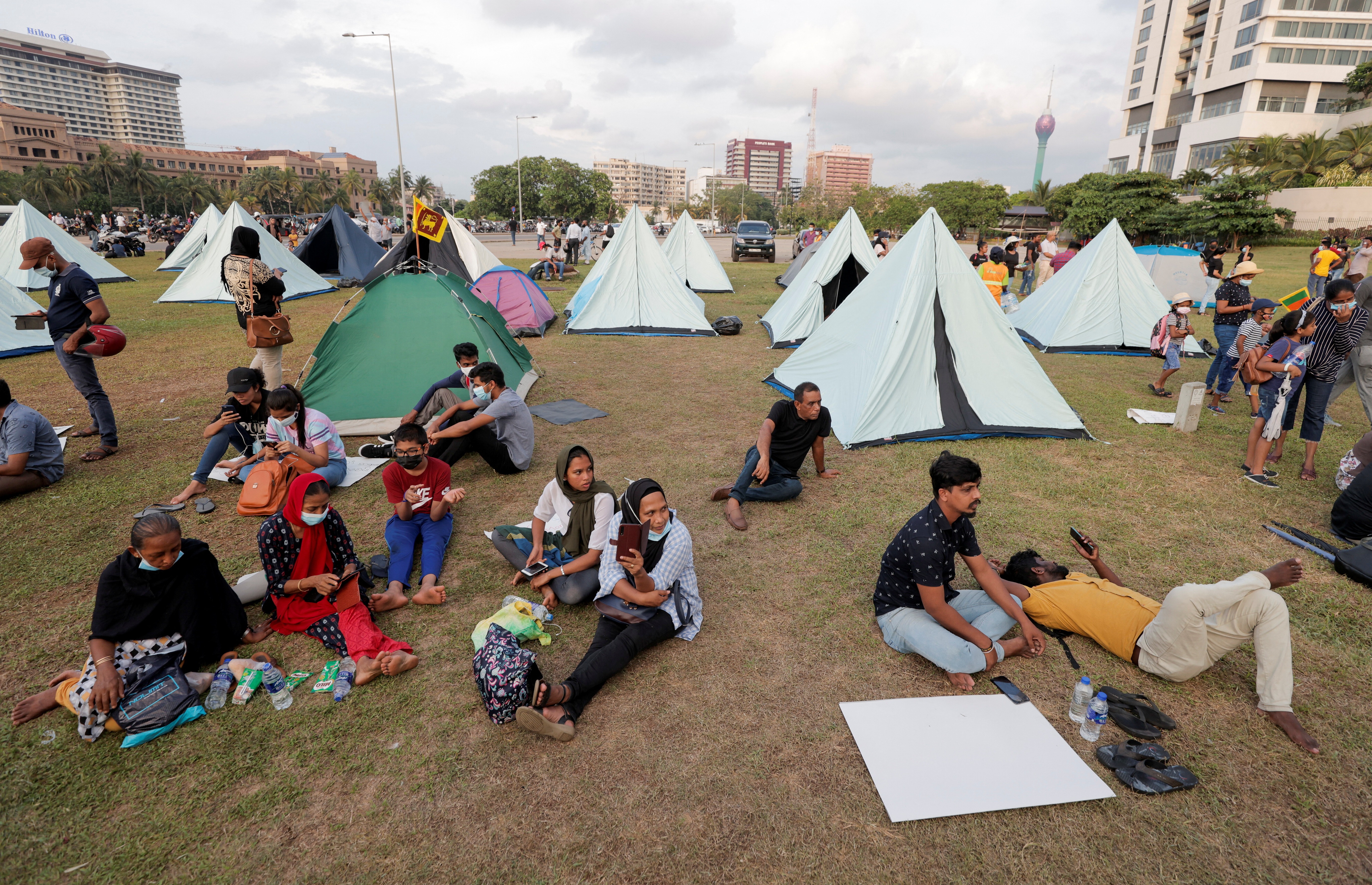 Demonstrators sit in a protest area in Colombo, Sri Lanka.