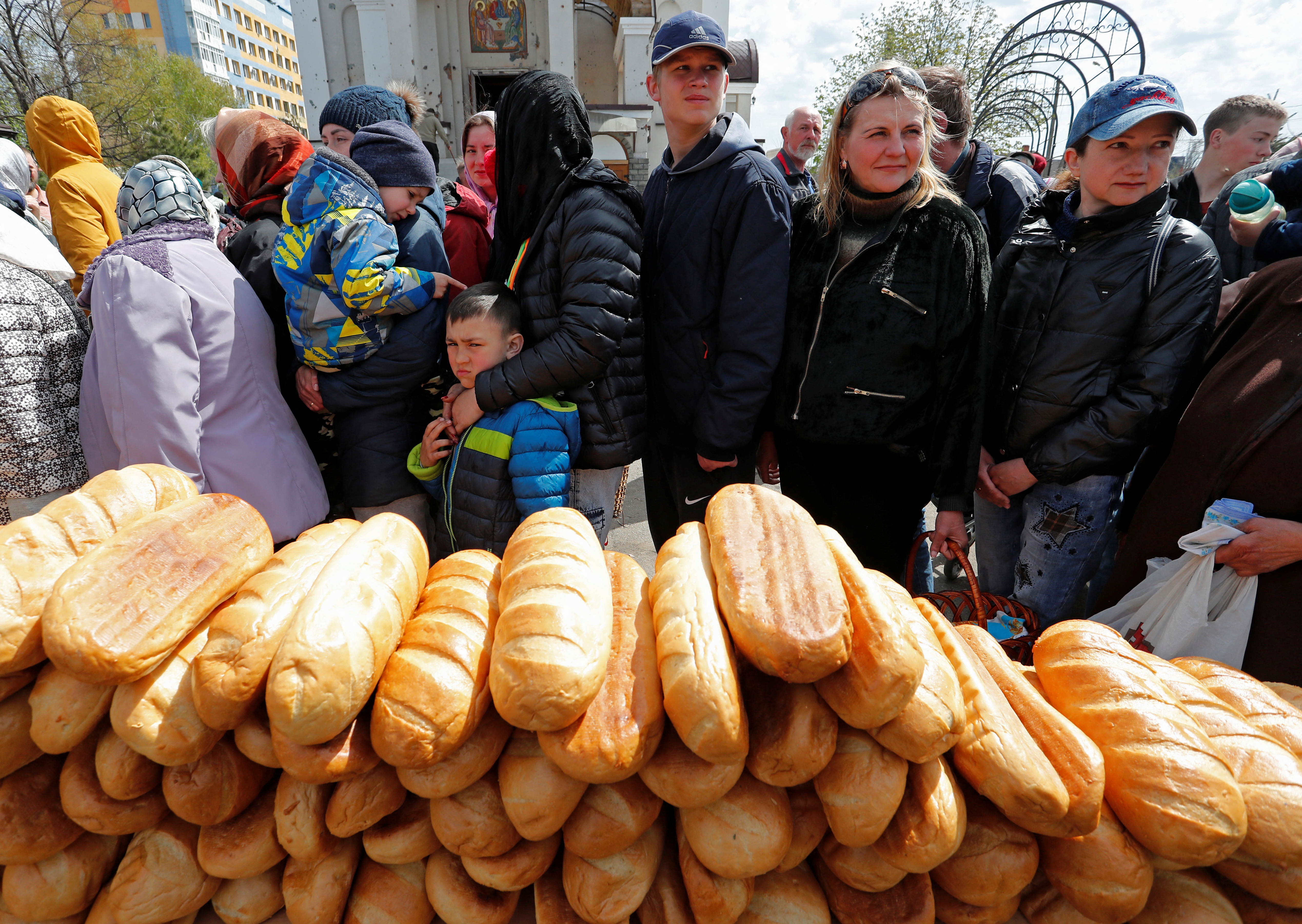 Local residents gather at the Svyato-Troitsky church on Easter Day in Mariupol