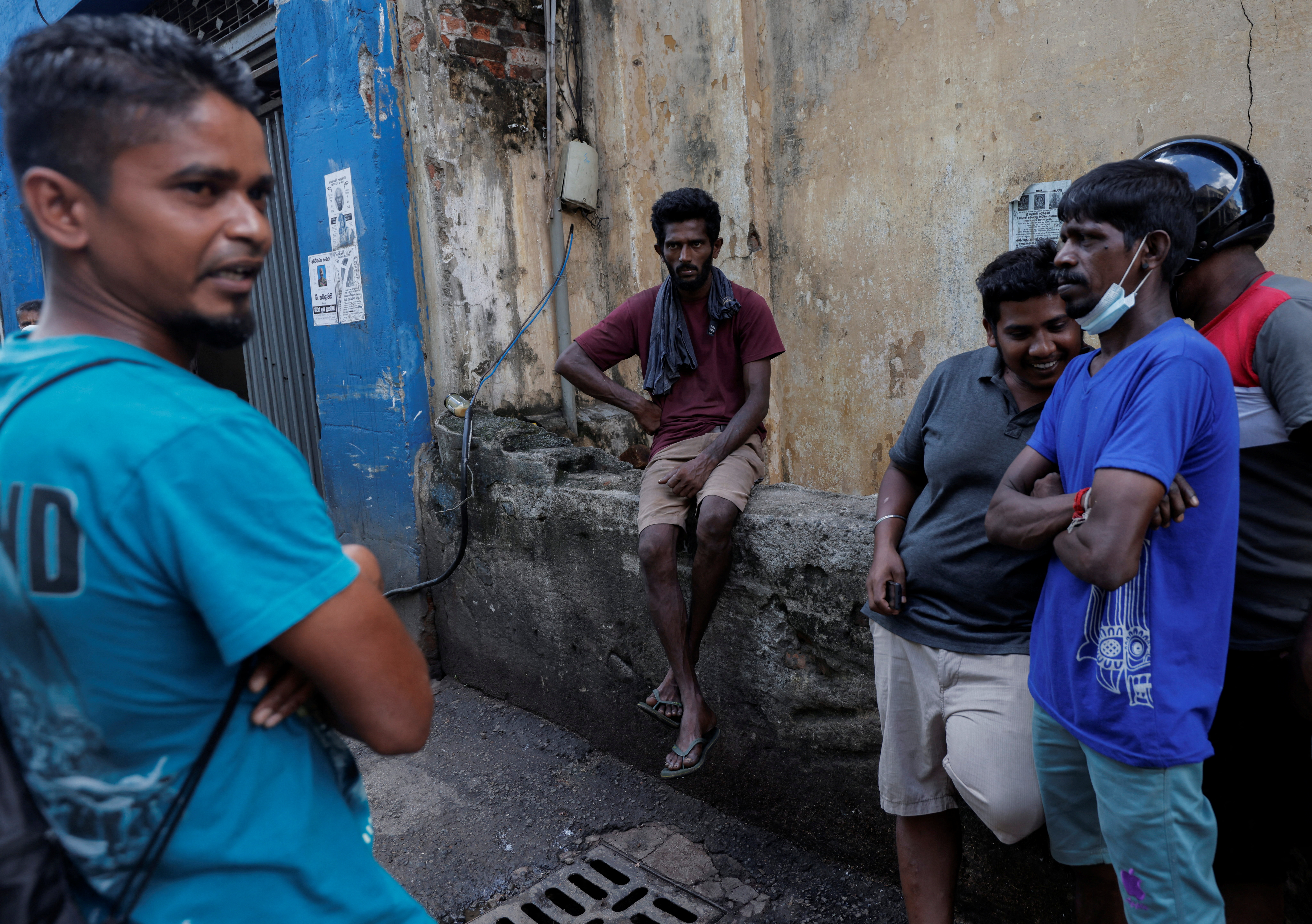 Workers are seen at a closed essential food store