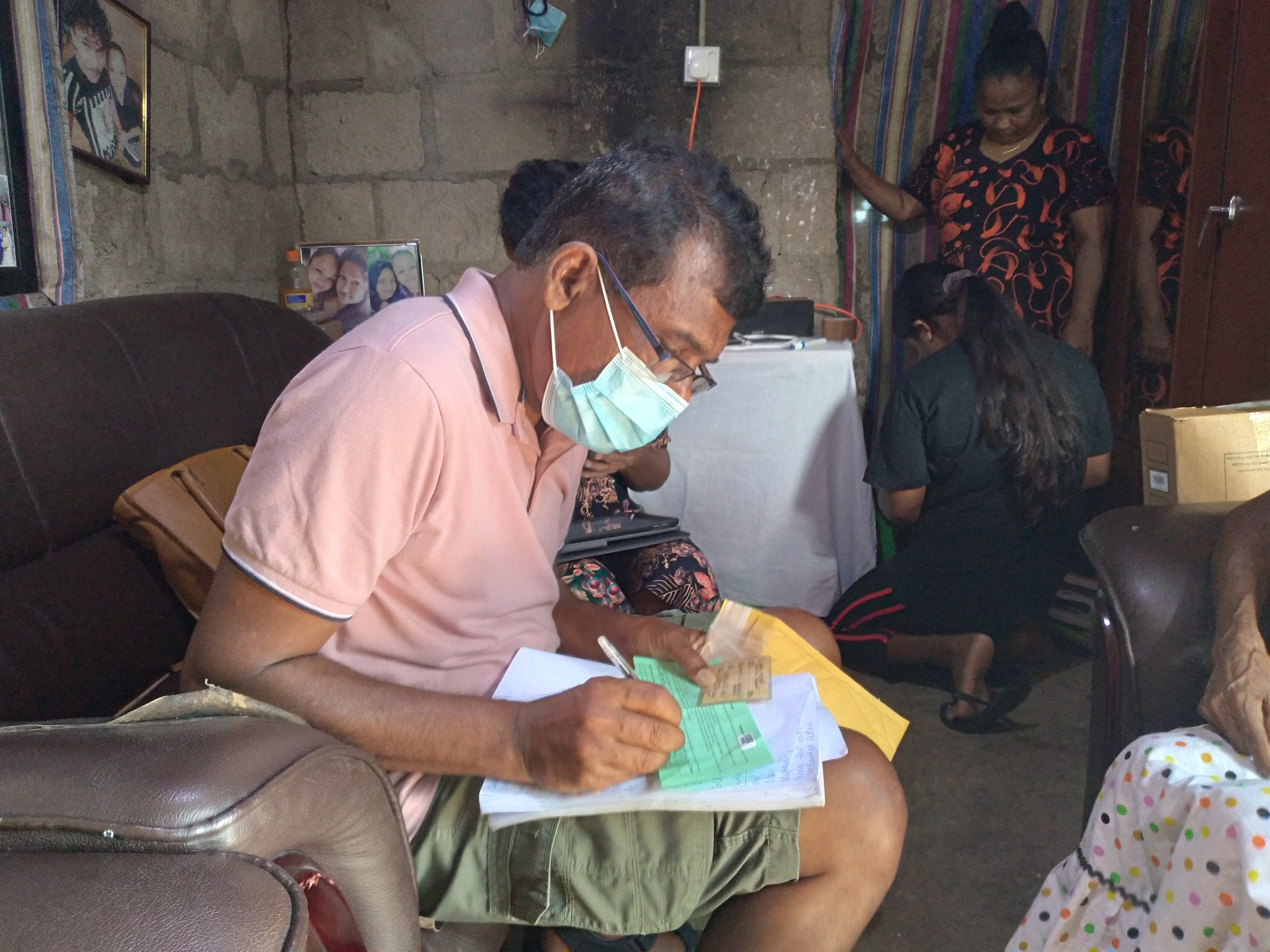A man writes in a book