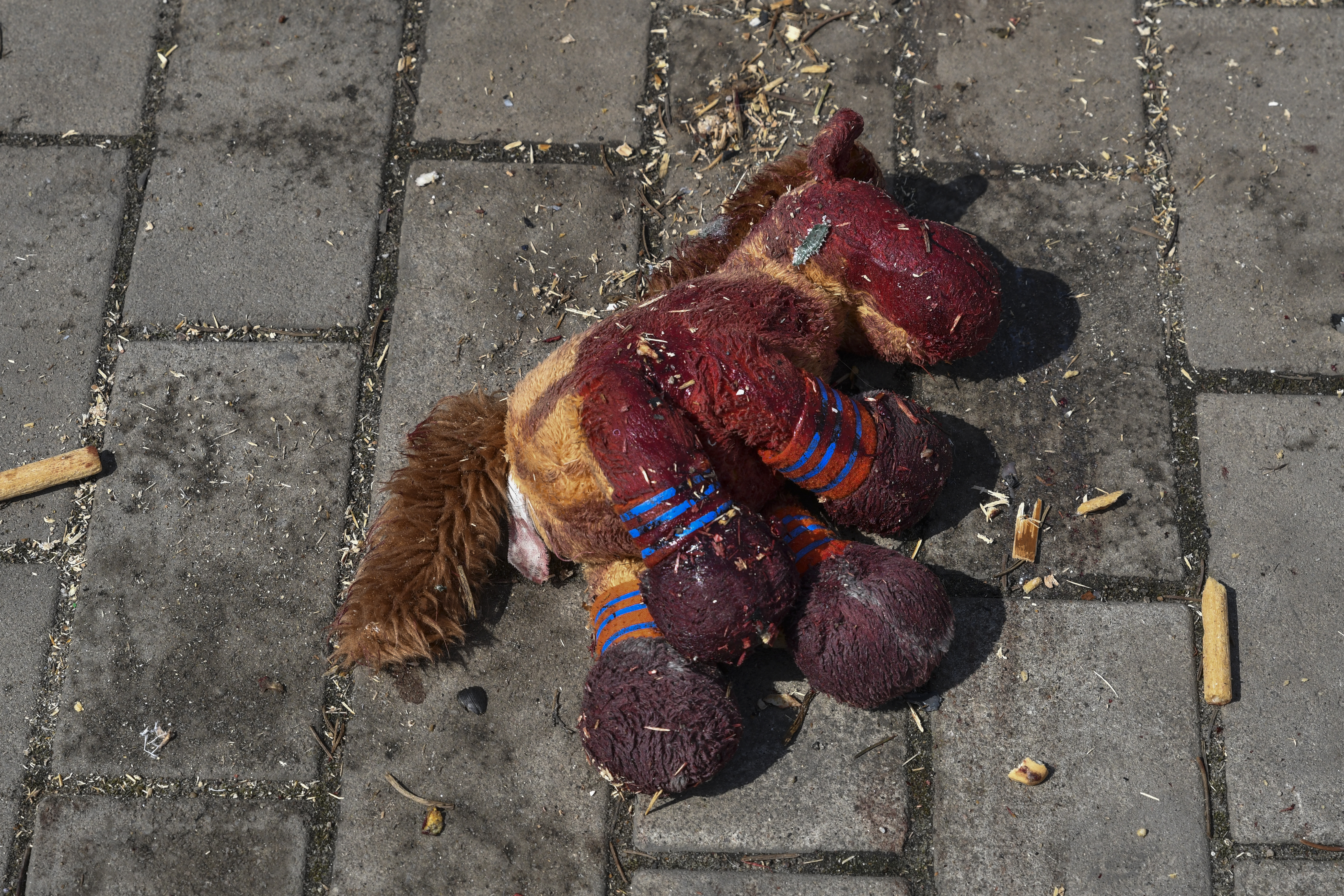 A stuffed horse with bloodstains on it