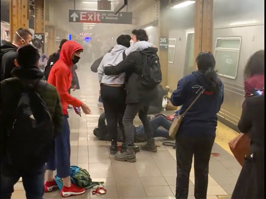 A a person is aided outside a subway car in the Brooklyn borough of New York,.