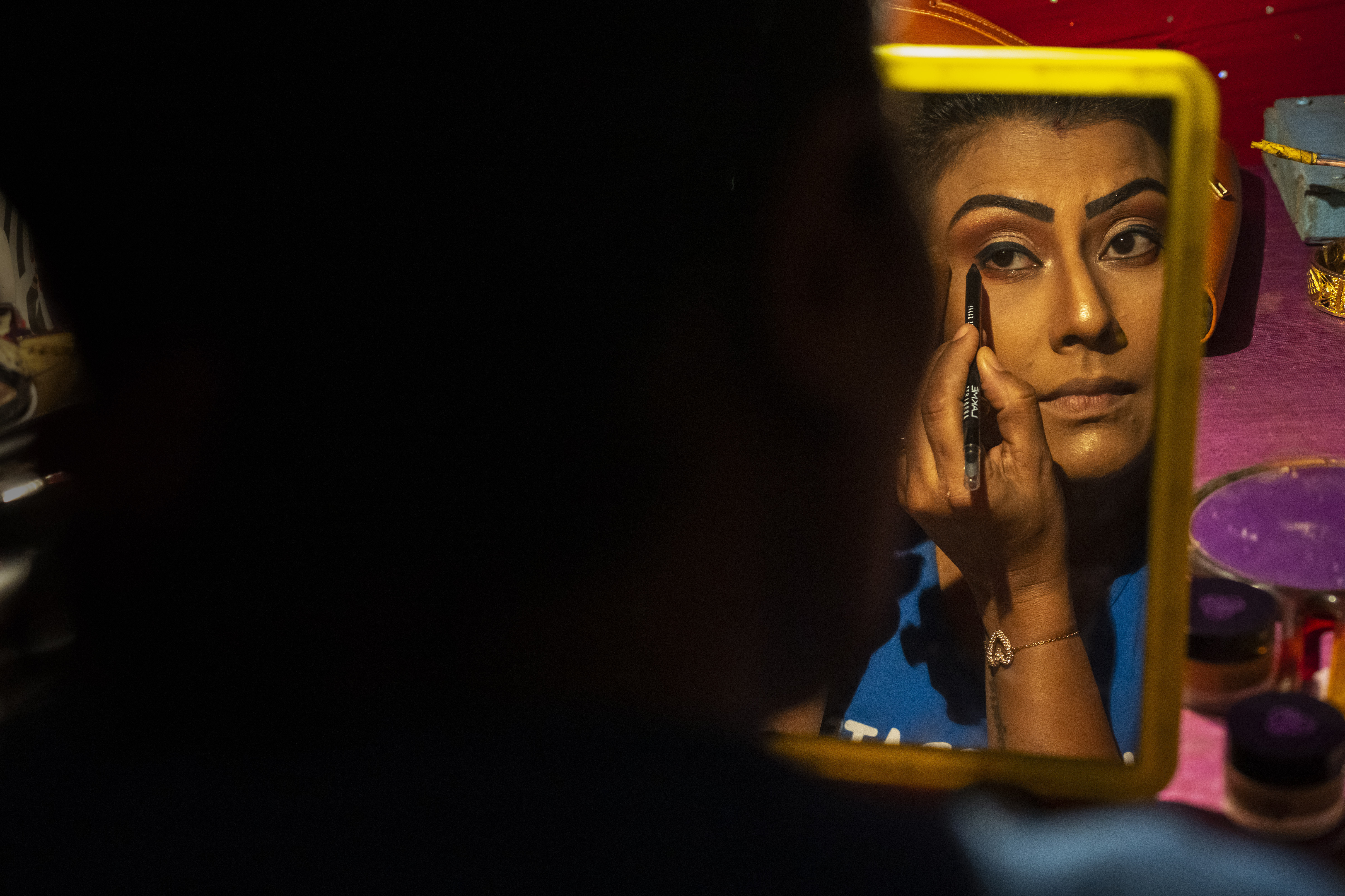 Prastuti Parashar, owner and lead actor of Awahan theater, prepares for a performance at Xetali village