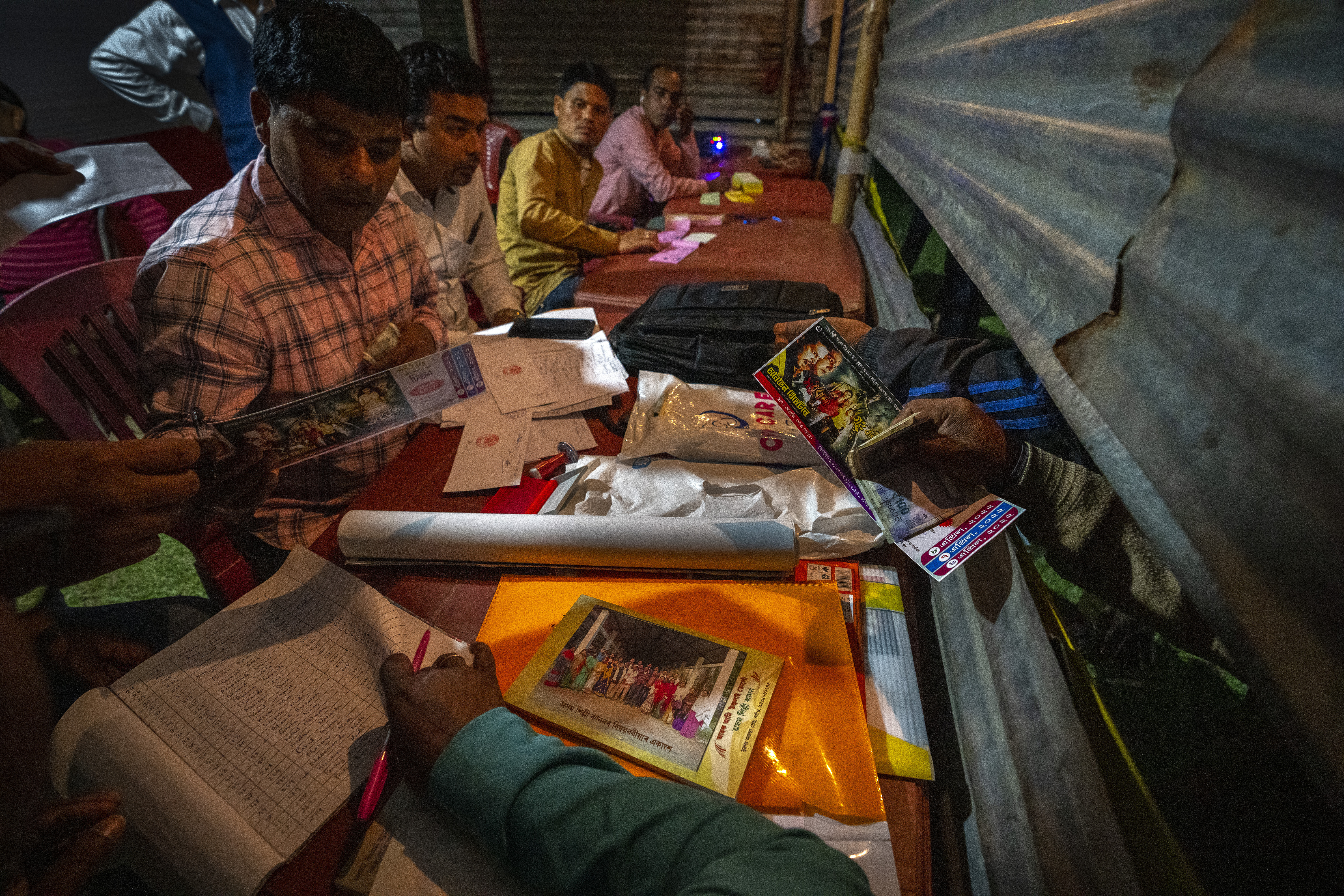 People buy tickets for a performance by Awahan traveling theater at Xetali,