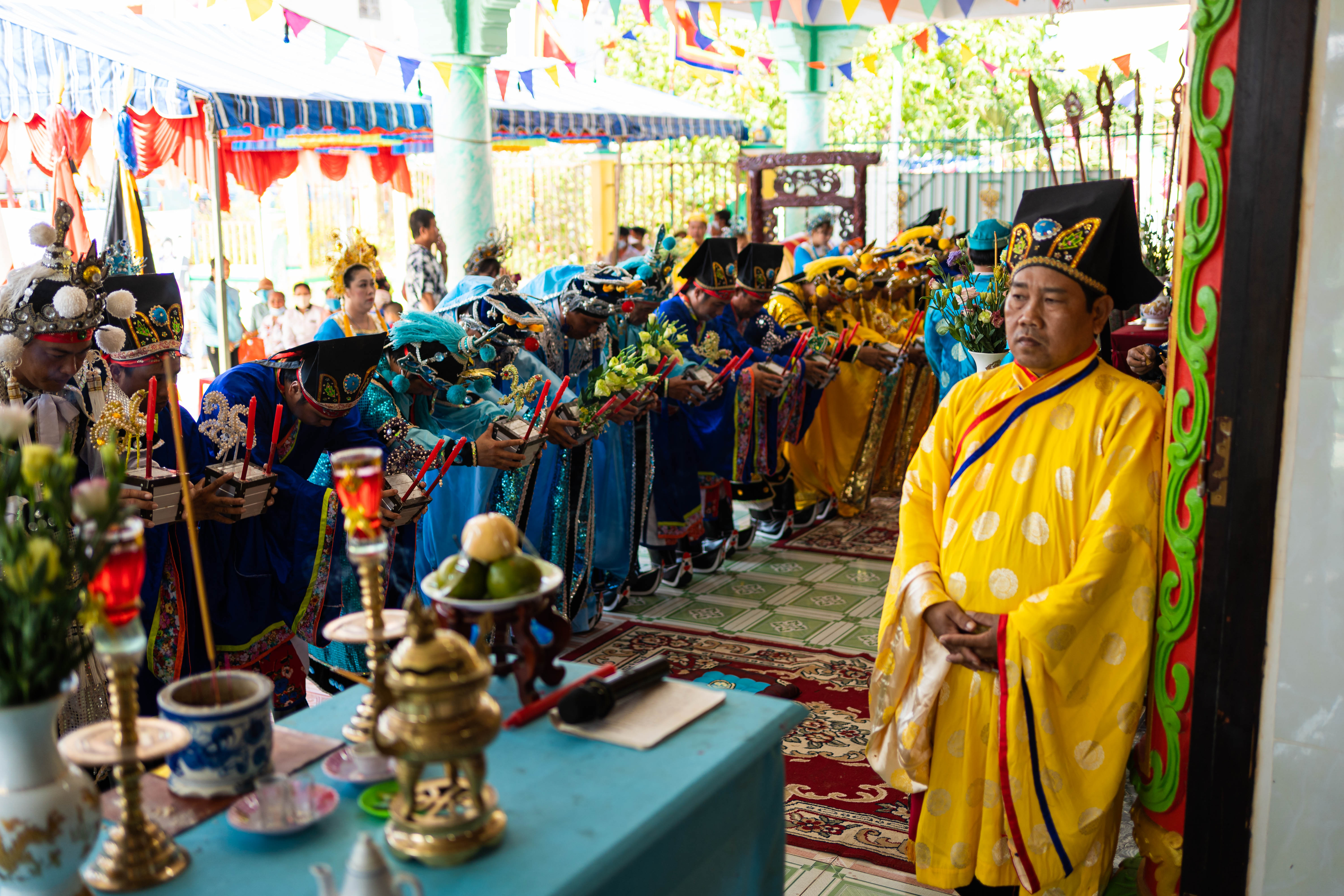 A photo of worshippers lining up with offerings before praying to whale spirits during Phuoc Hai’s whale worship festival.