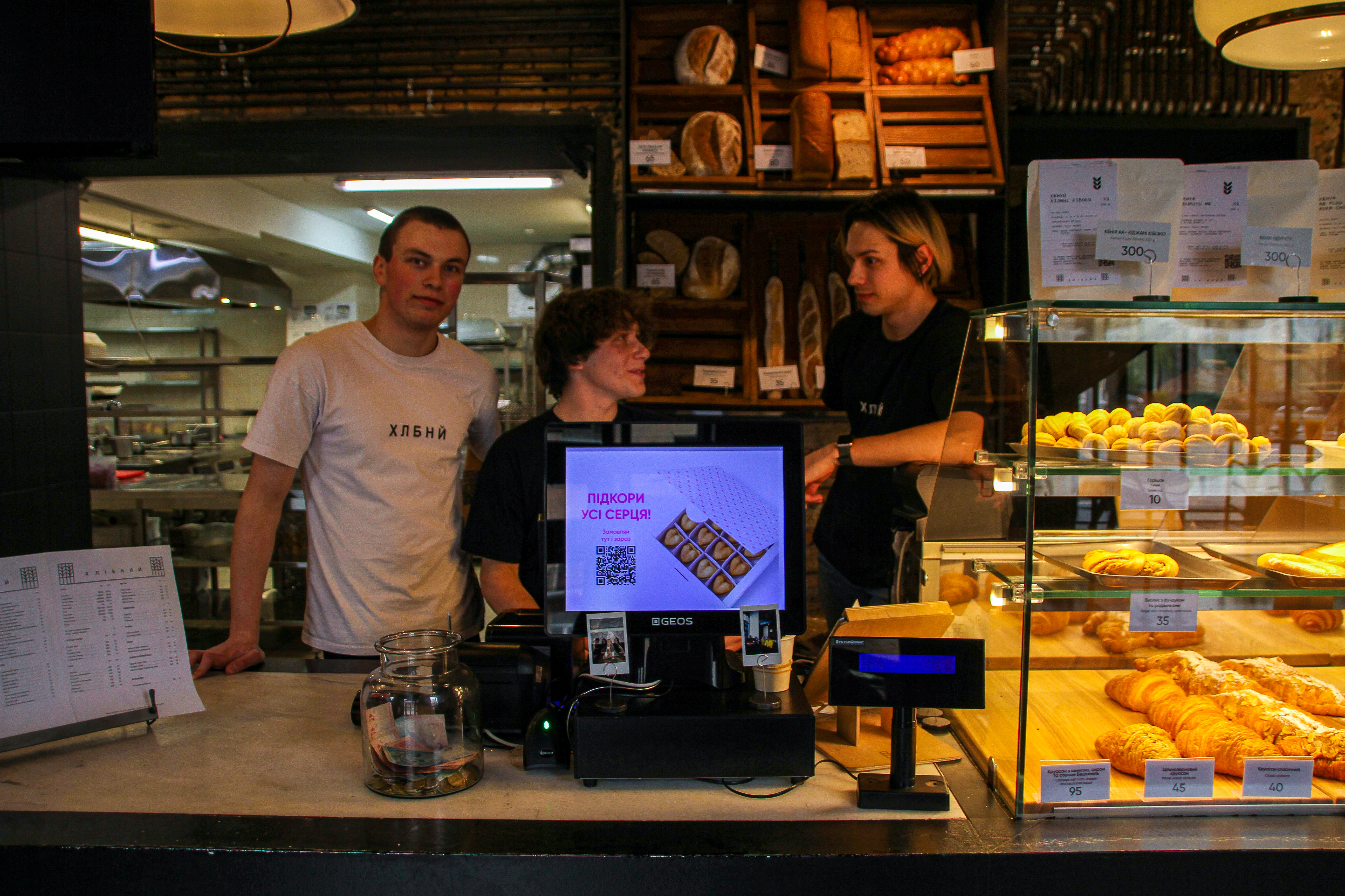 Cafe Khlebniy is now open as staff worker Andriy (middle) says they are welcoming more customers every day