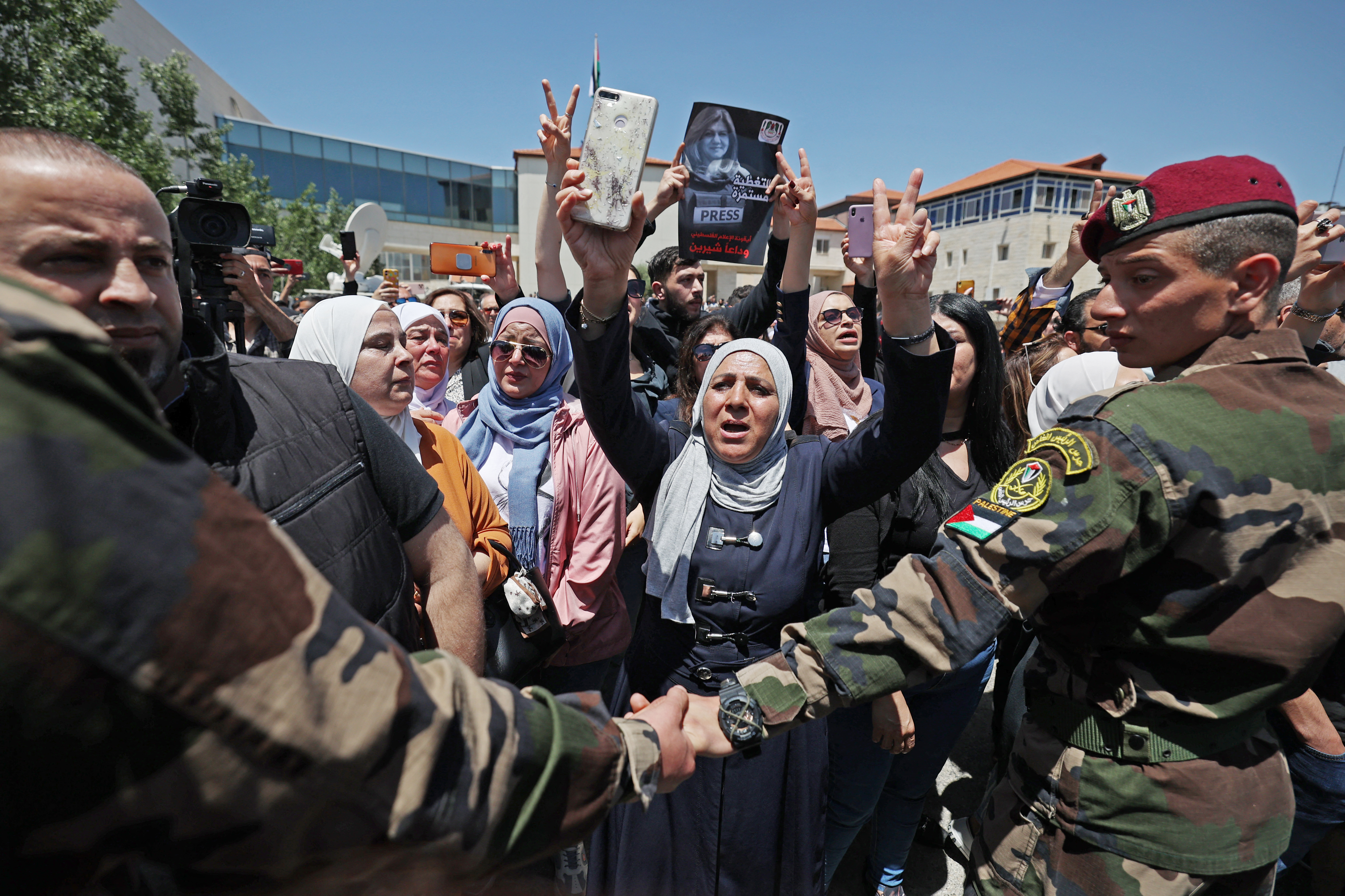 Palestinians attend a state service for veteran Al-Jazeera journalist Shireen Abu Akleh