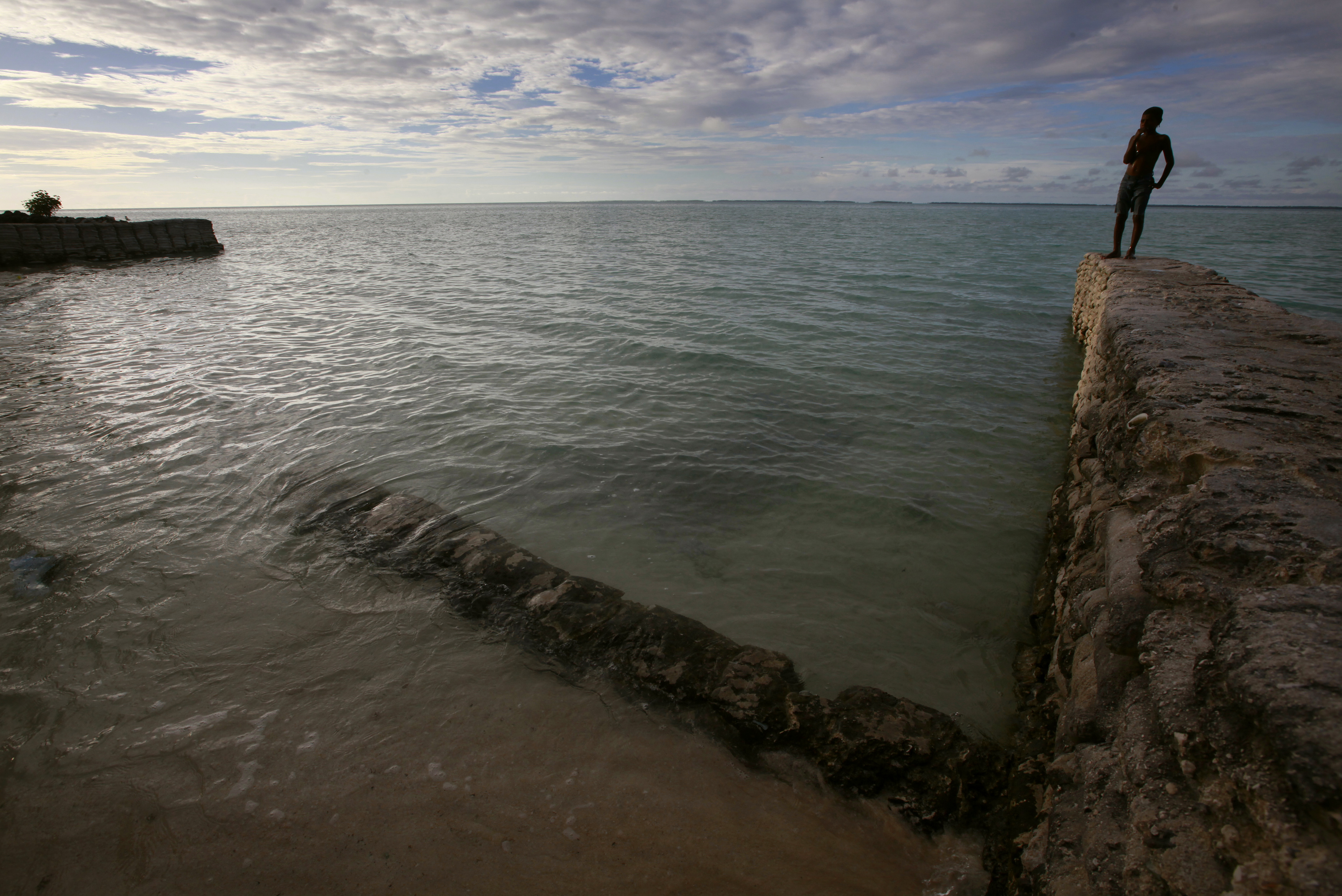 Boy watching the sea in Kiribati 