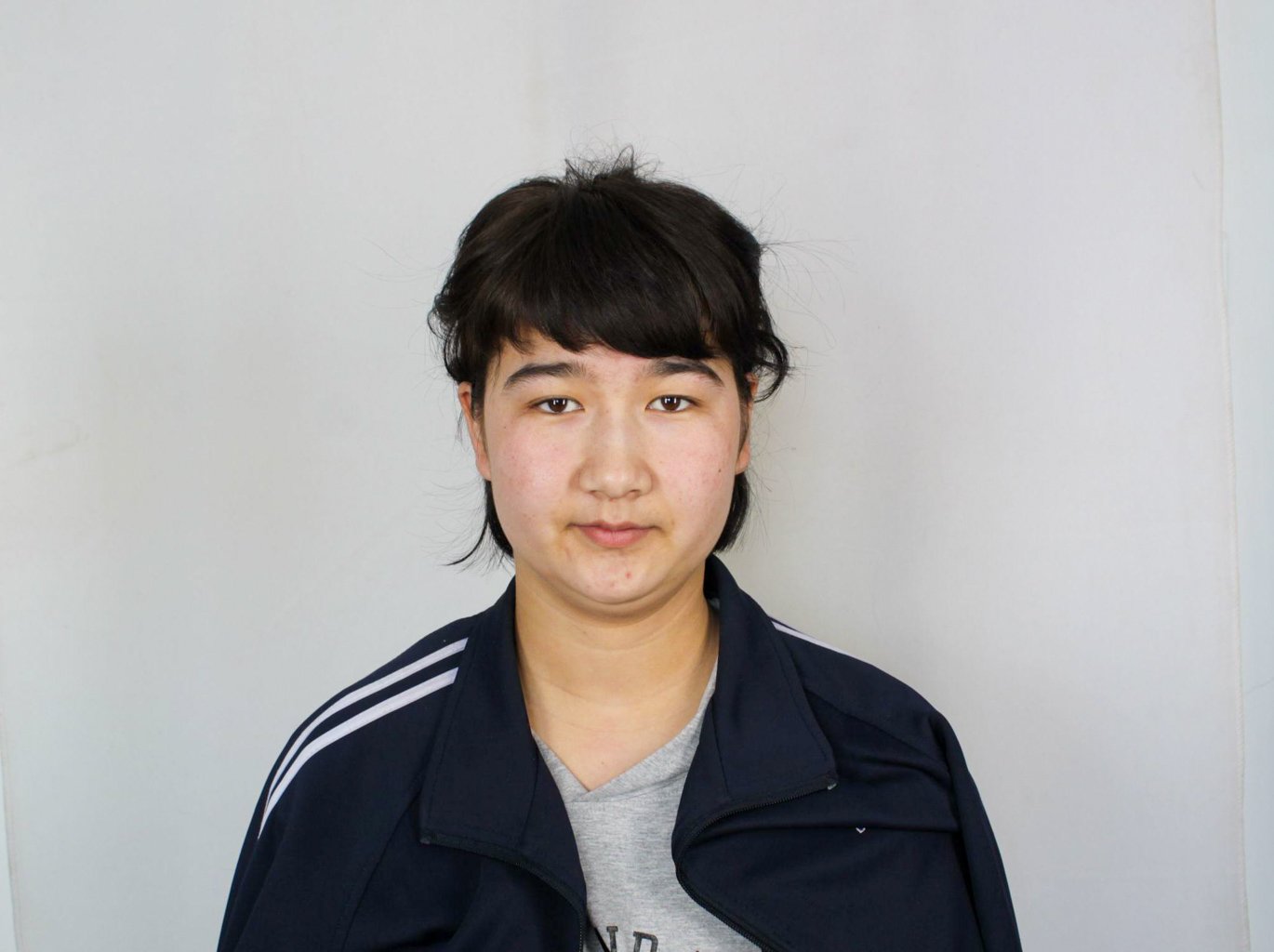 Rahile Memet, as an 18 year-old high-school student in 2018, was sentenced to re-education. Photo Courtesy of the Xinjiang Police Files project.