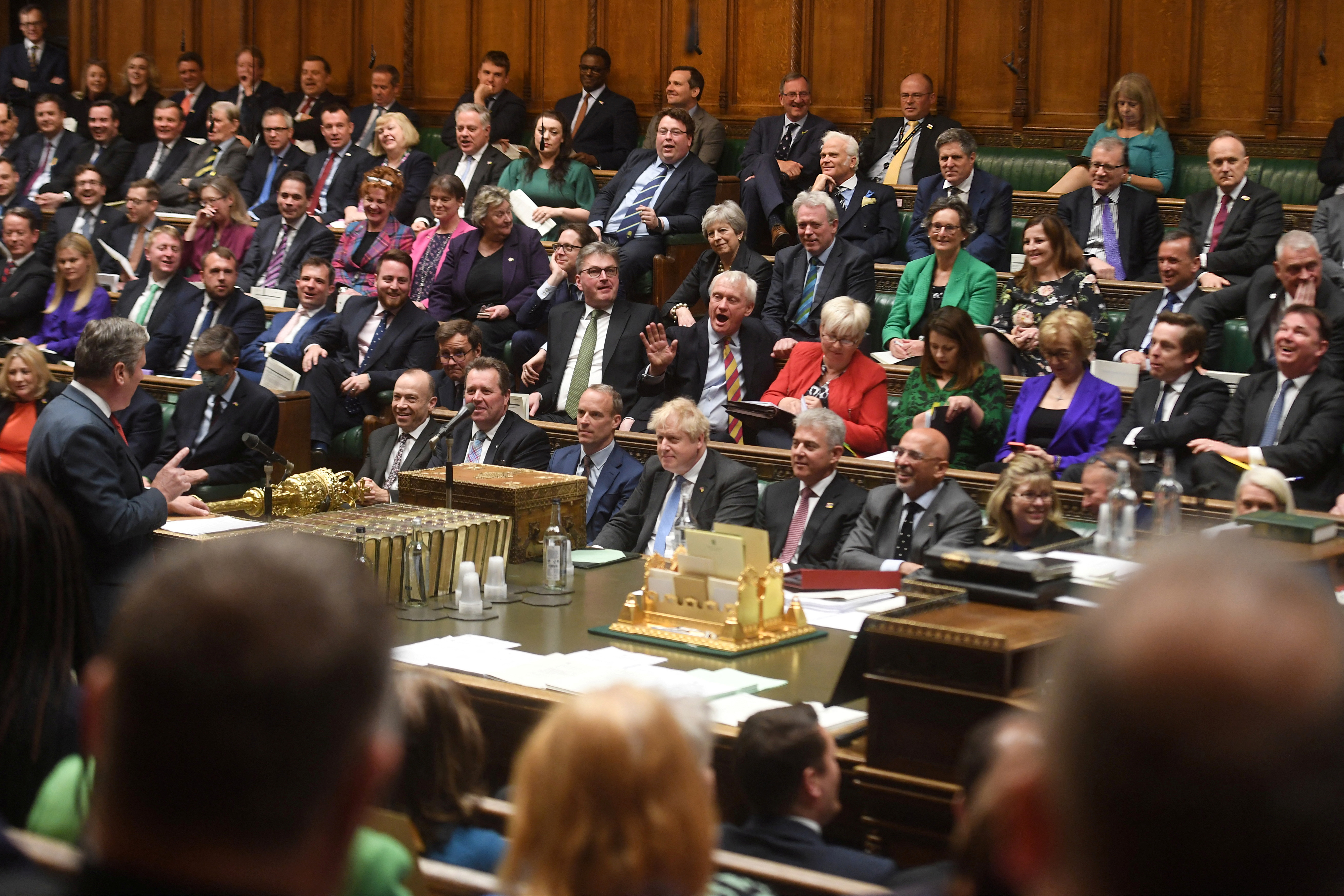 Conservative Party MPs react as British Labour Party opposition leader Keir Starmer gestures during ade debate