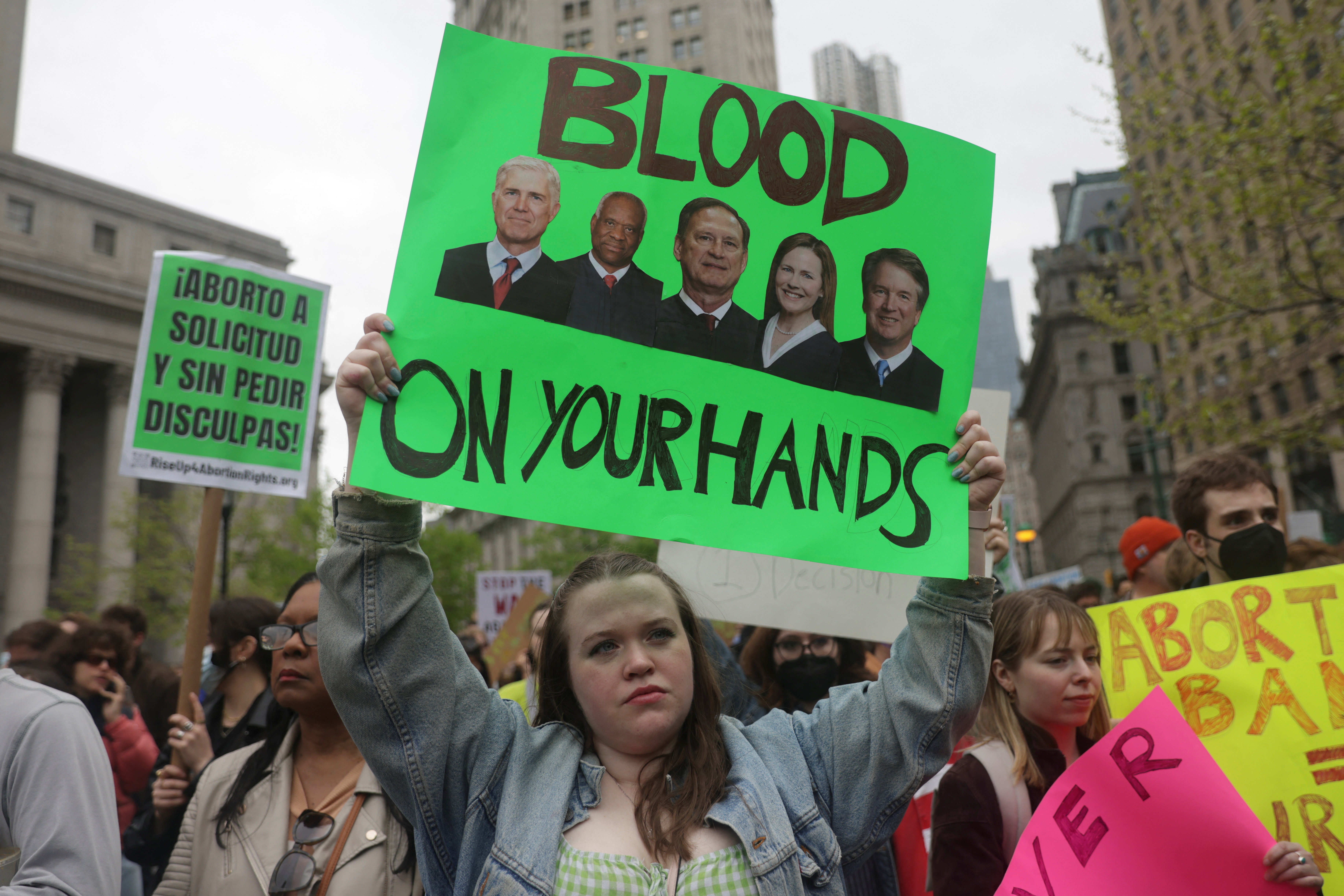 A protester holds a sign