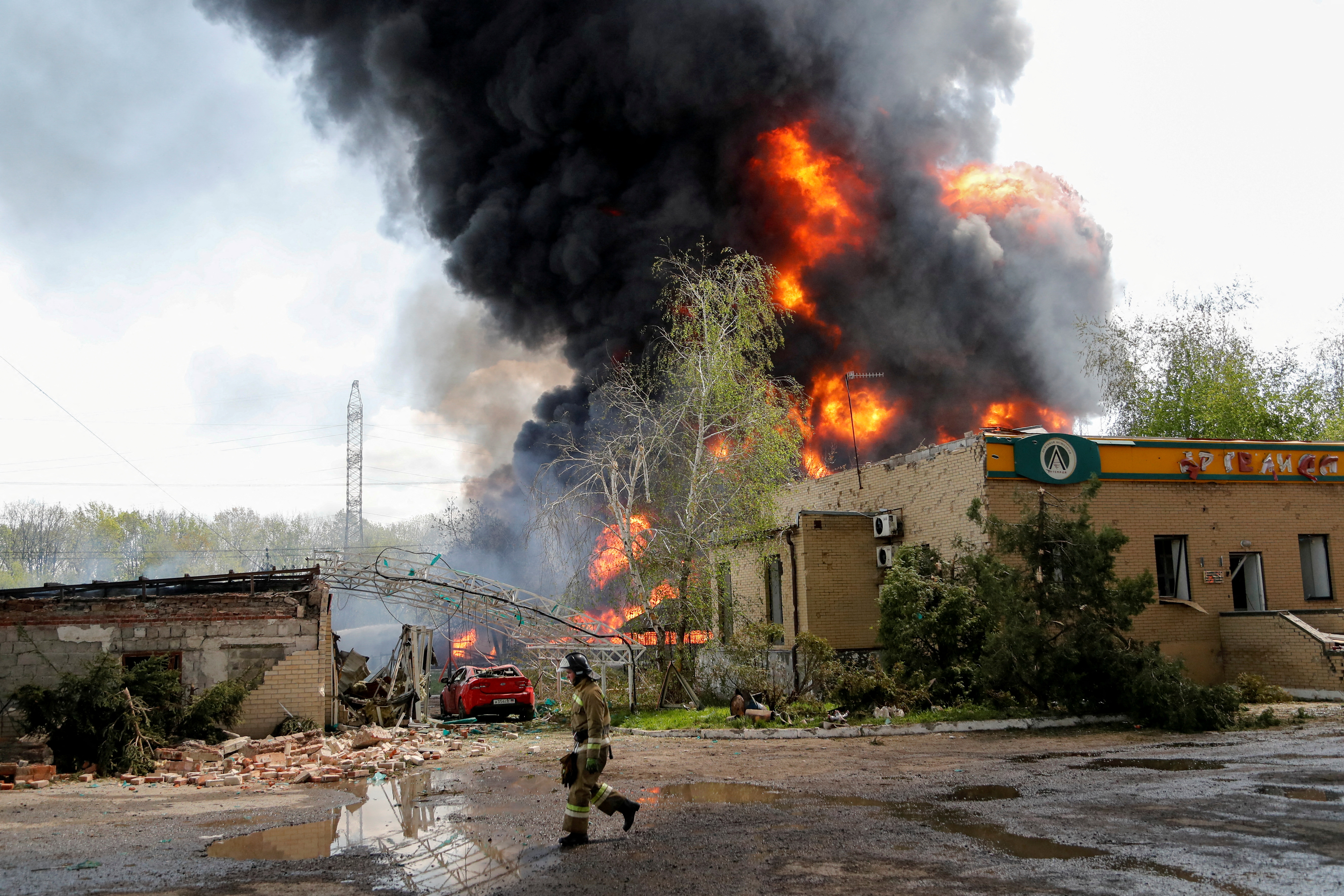 Smoke rises above a burning oil storage facility