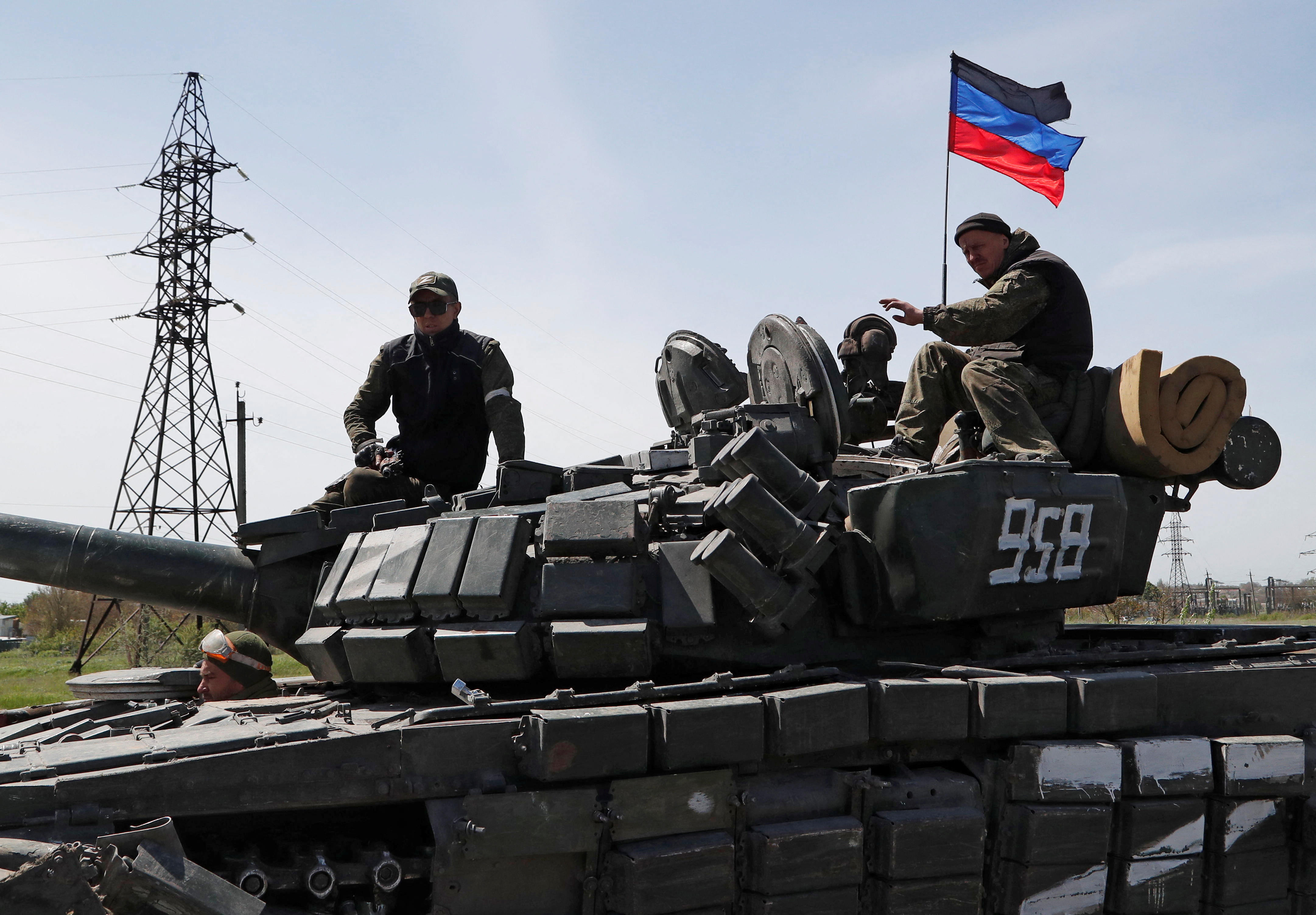 Pro-Russian troops are seen driving a tank in Ukraine's eastern Donetsk region.