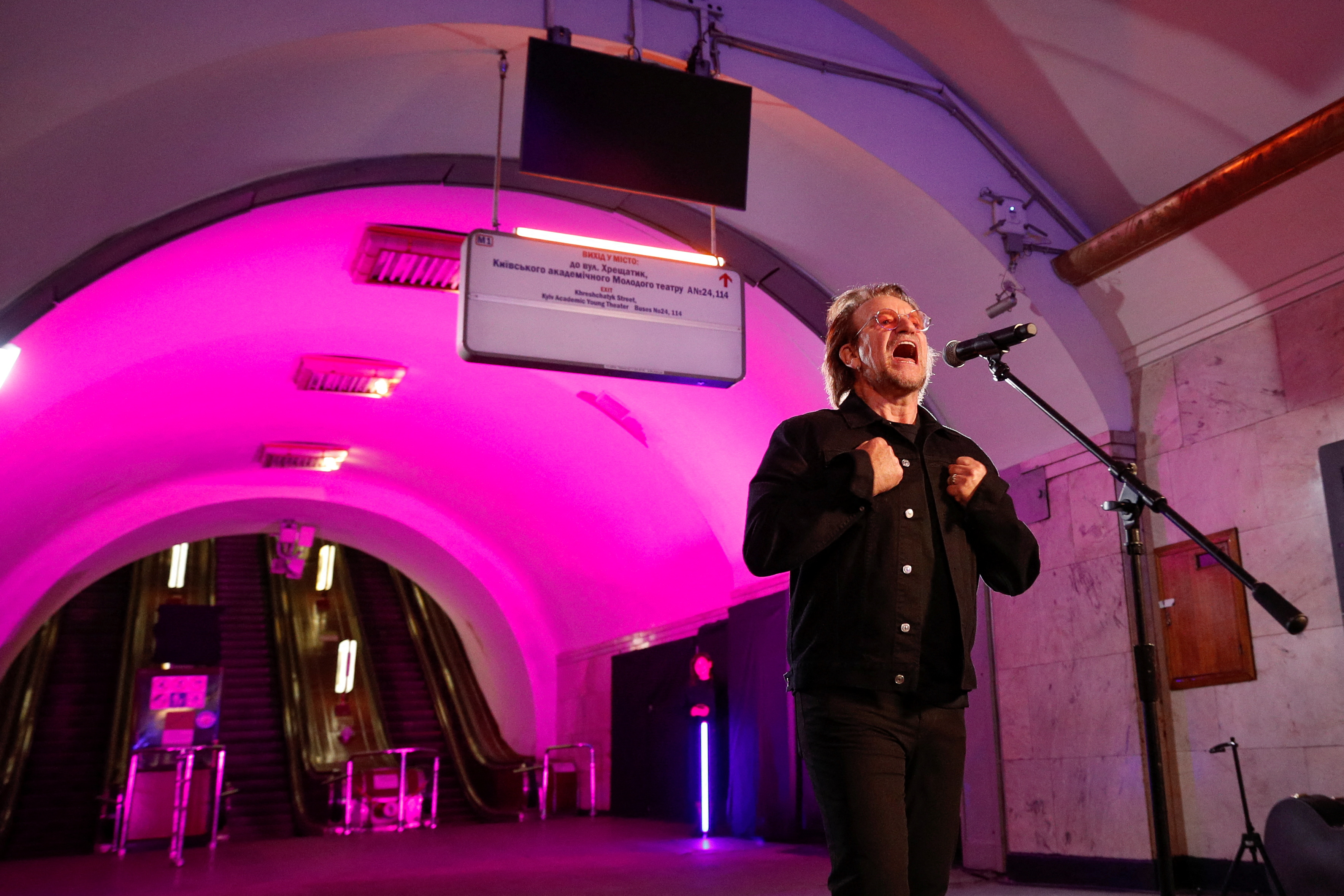 U2 rock band frontman Bono sings during a performance for Ukrainian people inside a subway station, as Russia's attack on Ukraine continues, in Kyiv, Ukraine