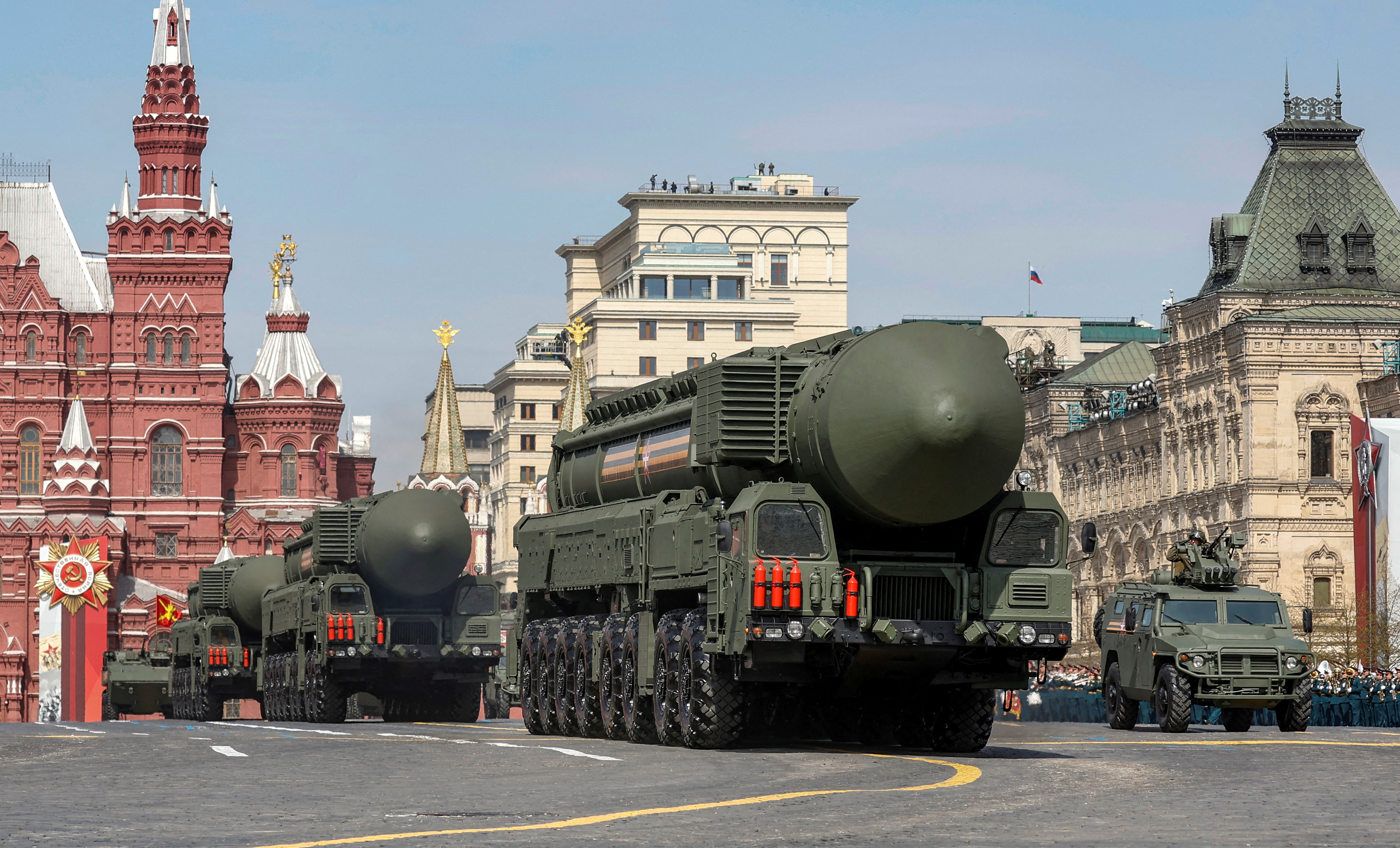 Russian military vehicles, including Yars intercontinental ballistic missile systems, drive in Red Square during a rehearsal for a military parade