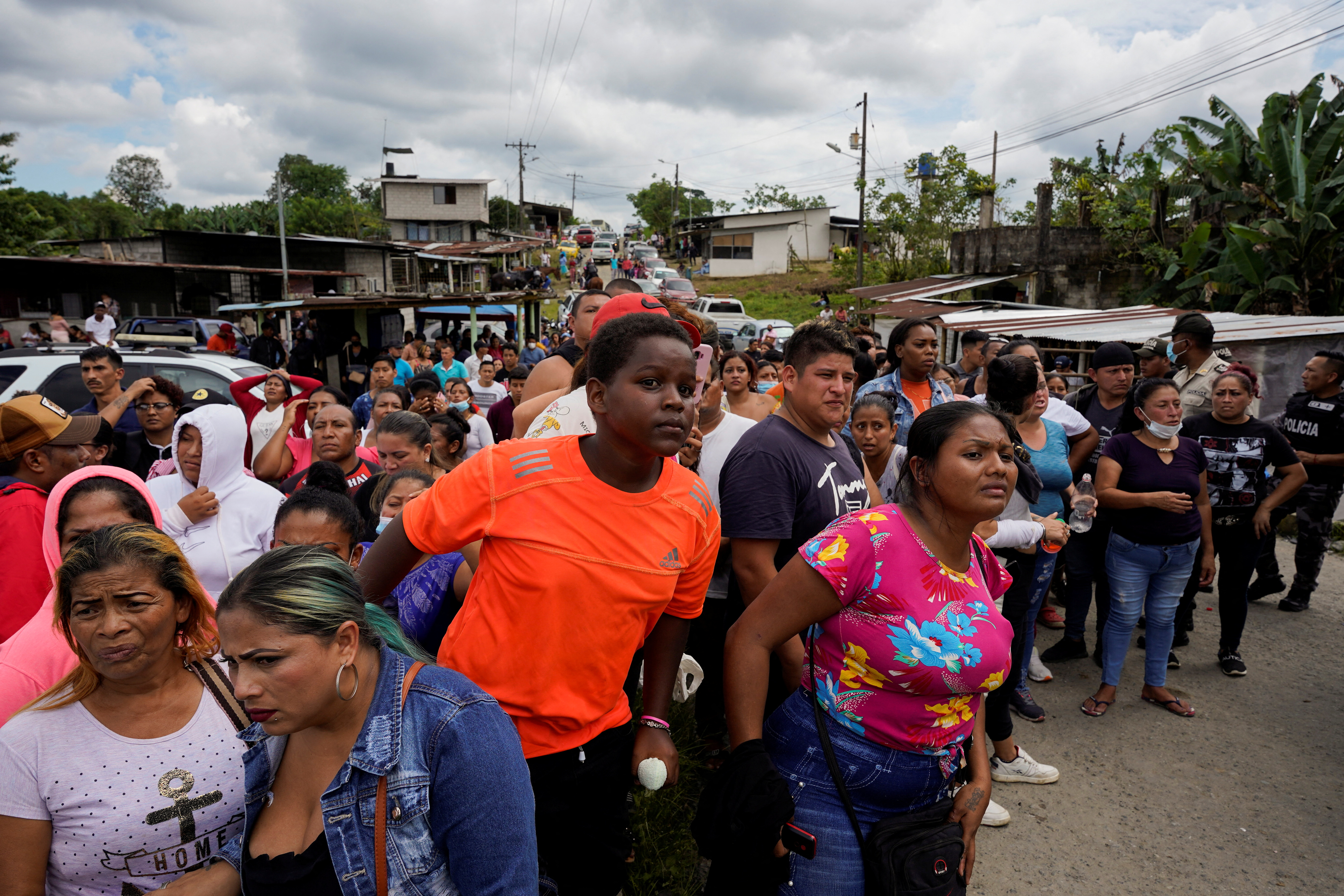 Family members gather outside the prison in Ecuador