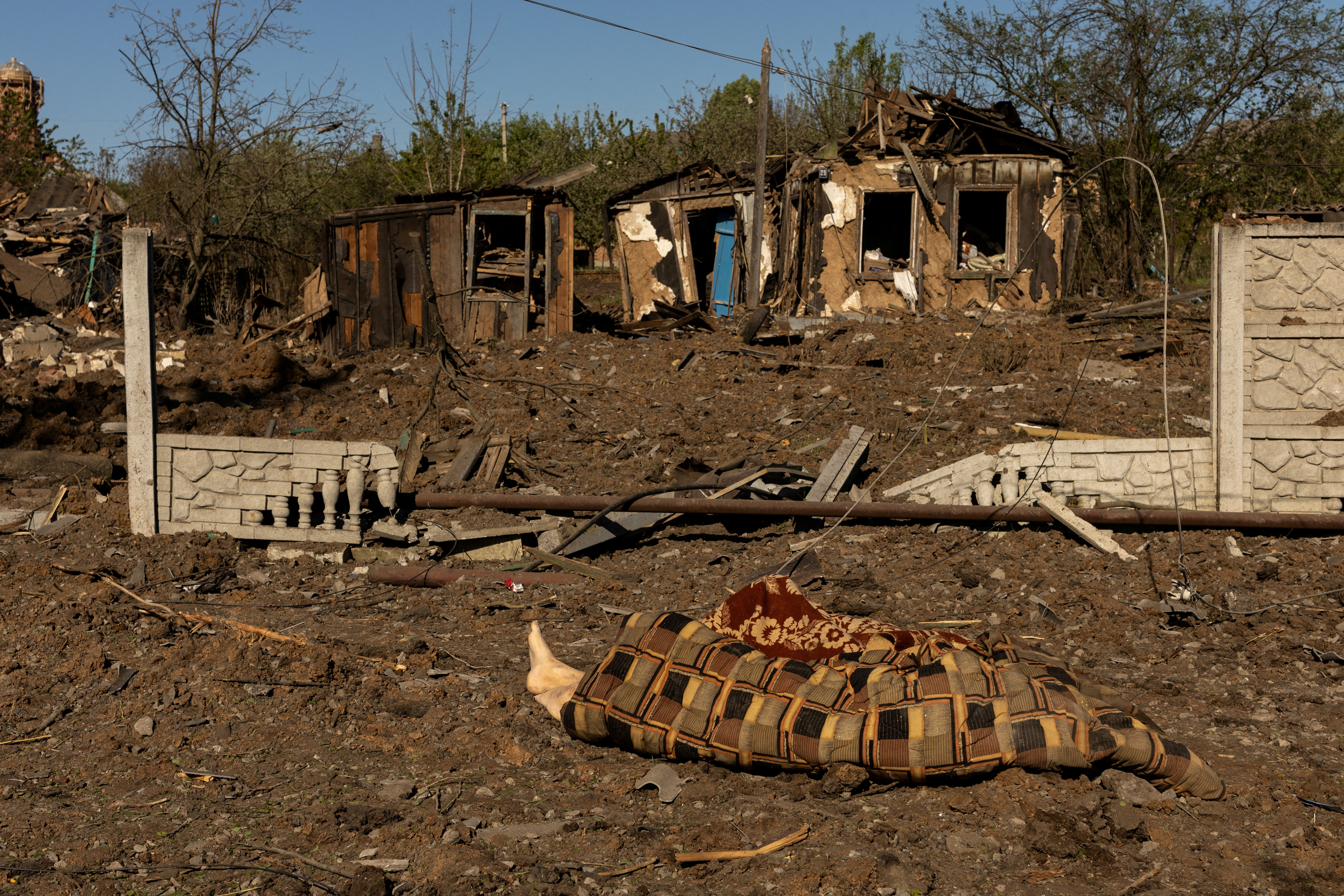 Two bodies lie on the ground after a missile strike hit a residential area amid Russia's invasion in Ukraine, in Bakhmut, Donetsk region
