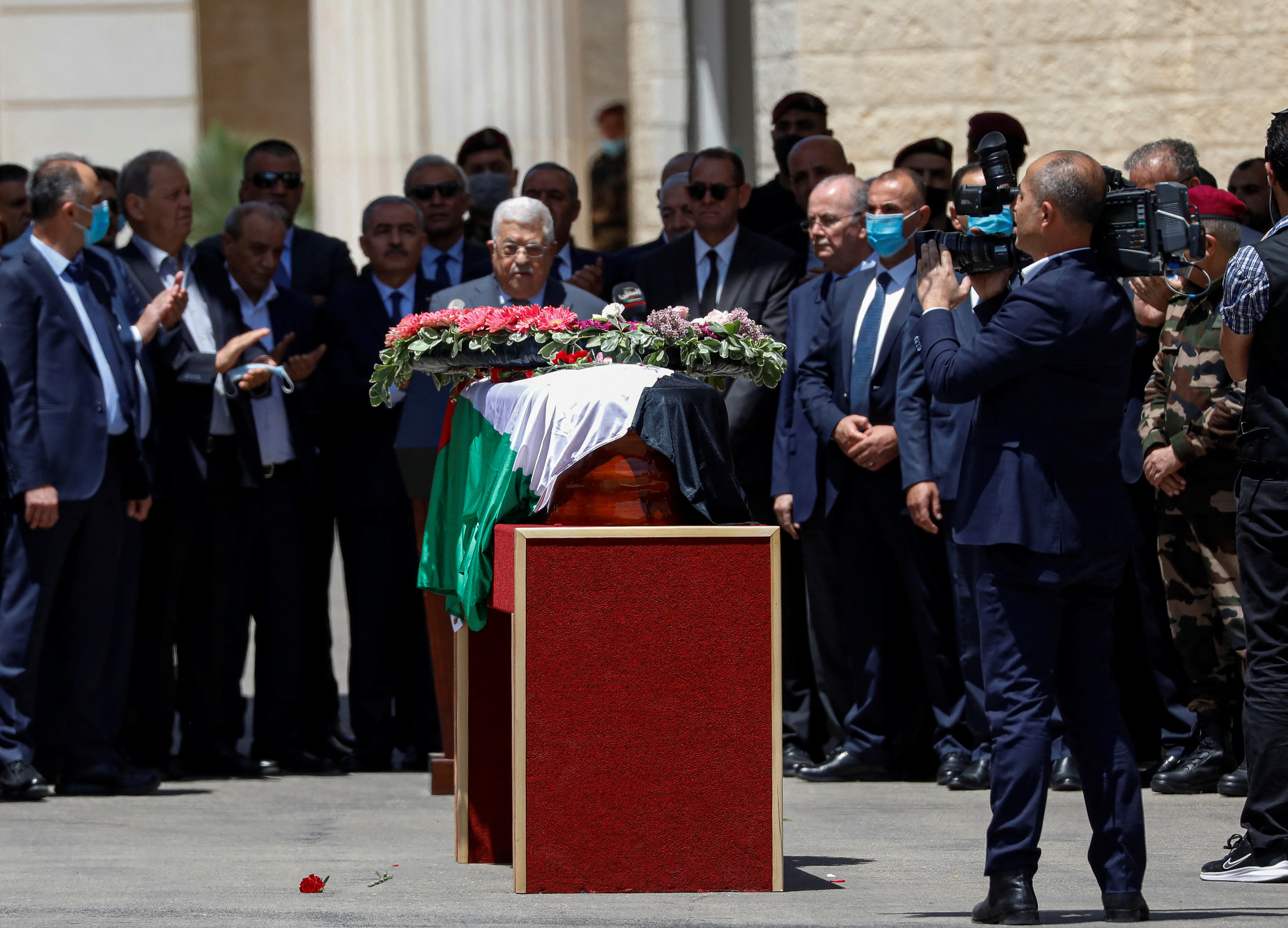 Palestinians attend a state service for veteran Al-Jazeera journalist Shireen Abu Akleh